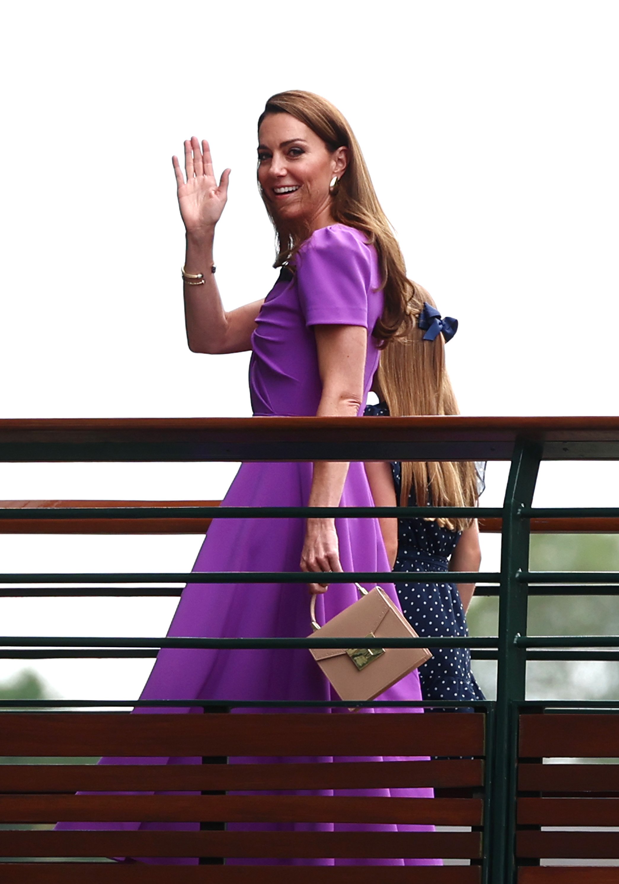 Kate Middleton waves from the players walkway bridge during The Championships Wimbledon 2024 on July 14, 2024, in London, England. | Source: Getty Images