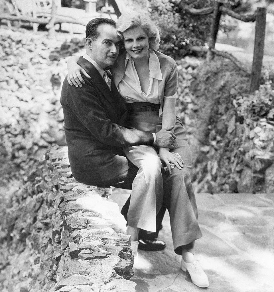 Paul Bern, noted producer, scenario writer and studio executive, whose suicide has shocked the country, and his bride, Jean Harlow, famous for her platinum hair. This picture was taken shortly after their marriage. | Source: Getty Images