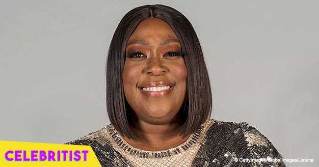 Loni Love shows off slimmer curves in peach, silky midi dress after impressive weight loss