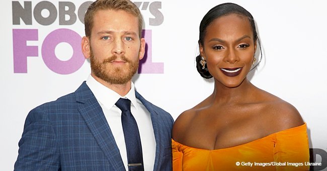 Tika Sumpter stuns in busty yellow dress in pic with partner after interracial marriage backlash