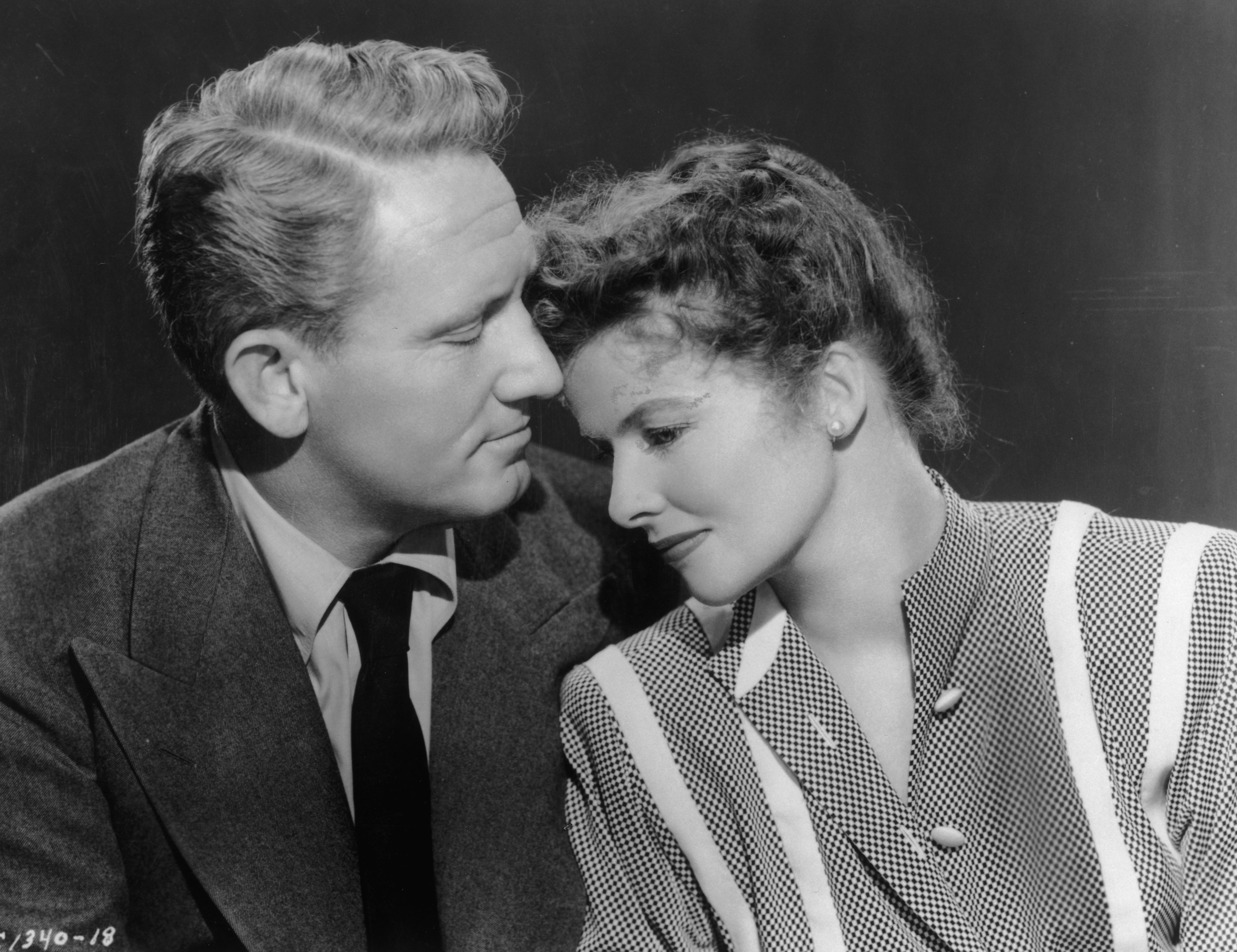 American actors Spencer Tracy (1900 - 1967) and Katharine Hepburn (1907 - 2003) comfort one another in a still from director Harold S Bucquet's film, 'Without Love'. | Source: Getty Images