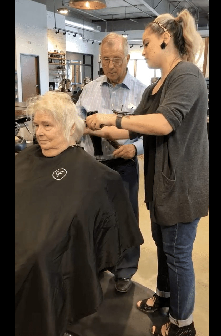 Andrew learns how to style his wife's hair. | Source: facebook.com/raigen.kelley