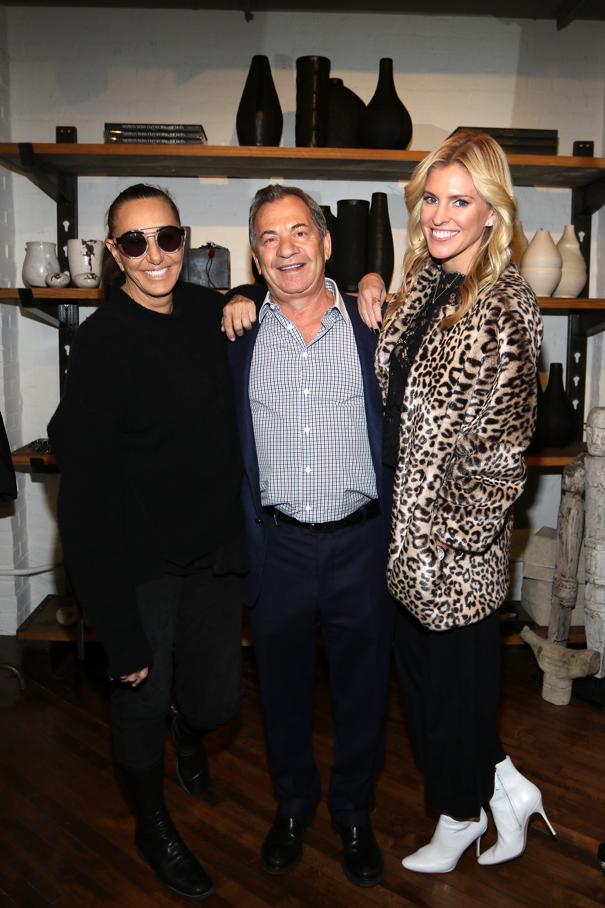 The couple also joined fashion icon Donna Karan for a photo op, with the author draping a bold leopard-print coat over her all-black ensemble. The trio shared an easy smile, capturing the celebratory spirit of the event.