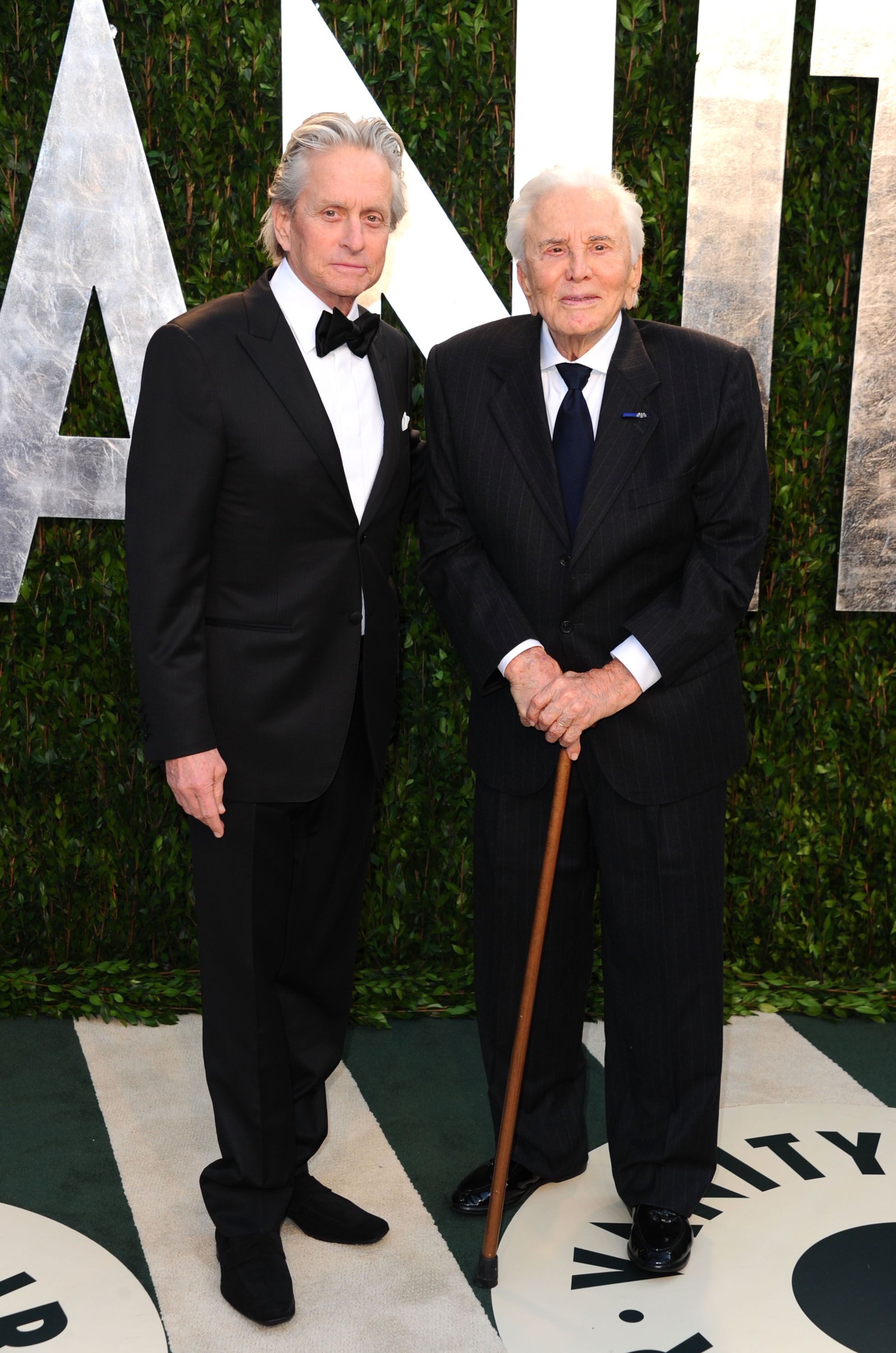 Michael Douglas and Kirk Douglas arrive at the 2012 Vanity Fair Oscar Party. | Source: Getty Images
