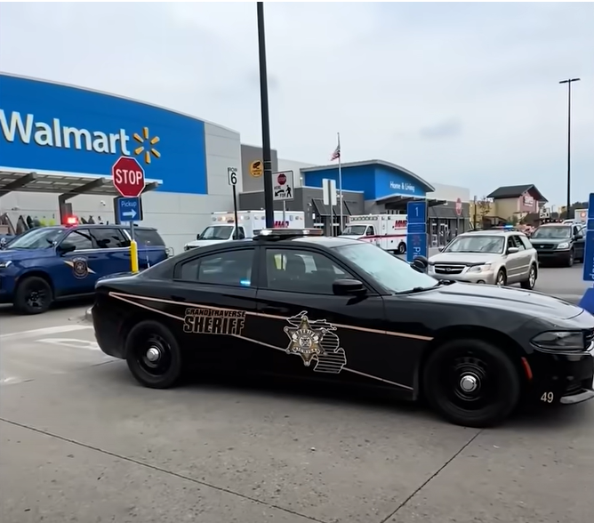 The Walmart store was heavily guarded by police cars, from a video posted on July 27, 2025 | Source: YouTube/NewYorkPost