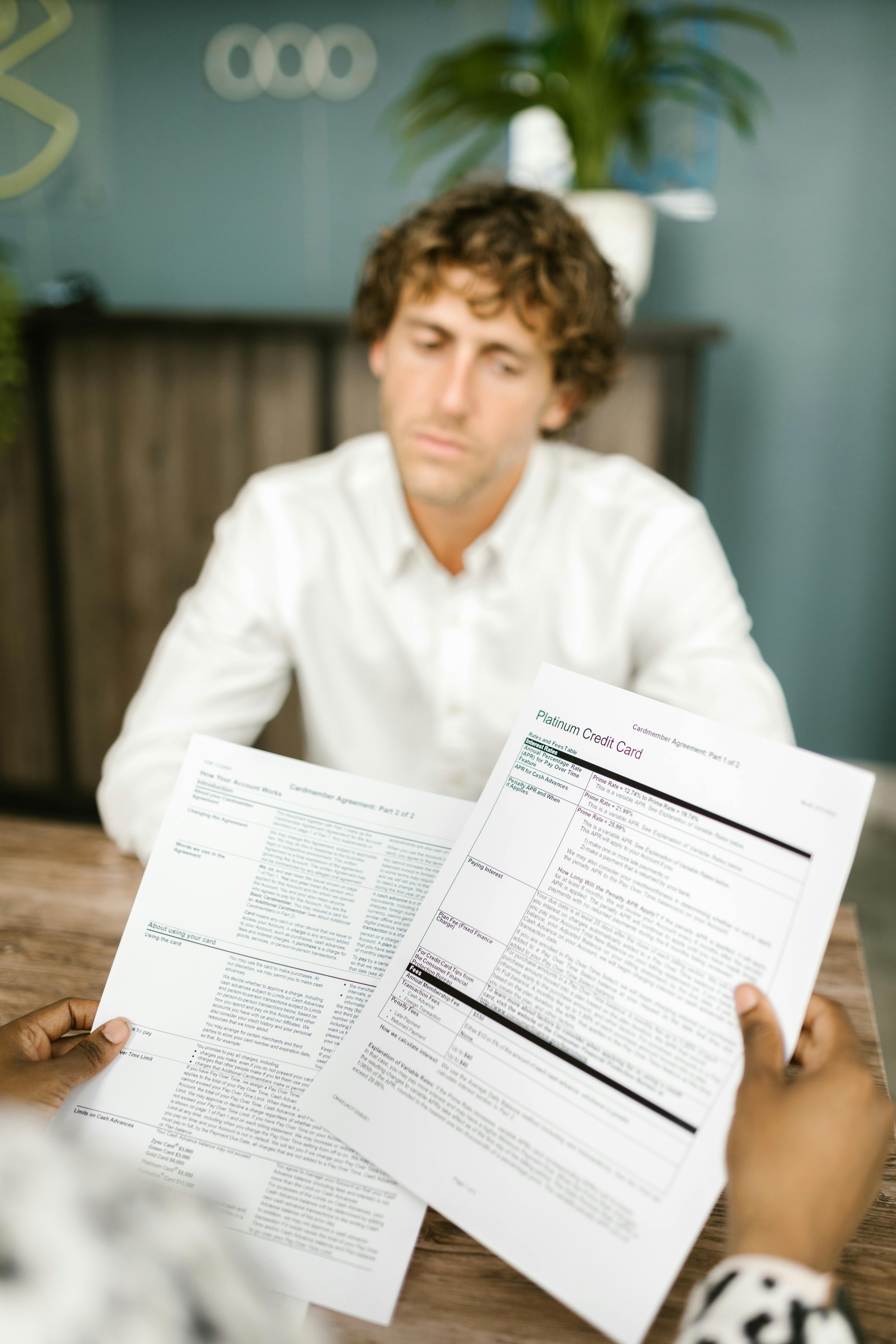 A man applying with papers | Source: Pexels