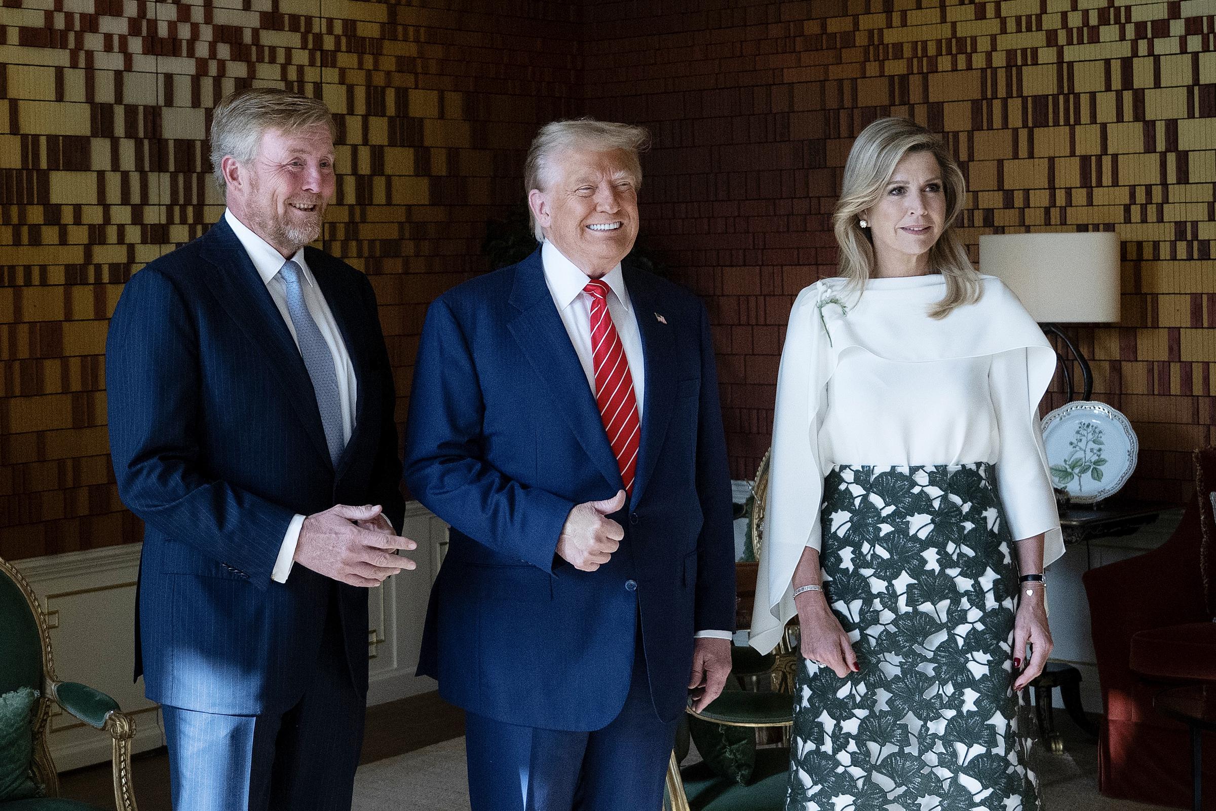 The next day, Trump posed with King Willem-Alexander and Queen Máxima of the Netherlands on the sidelines of the NATO summit, all three sharing bright smiles during the friendly photo op.