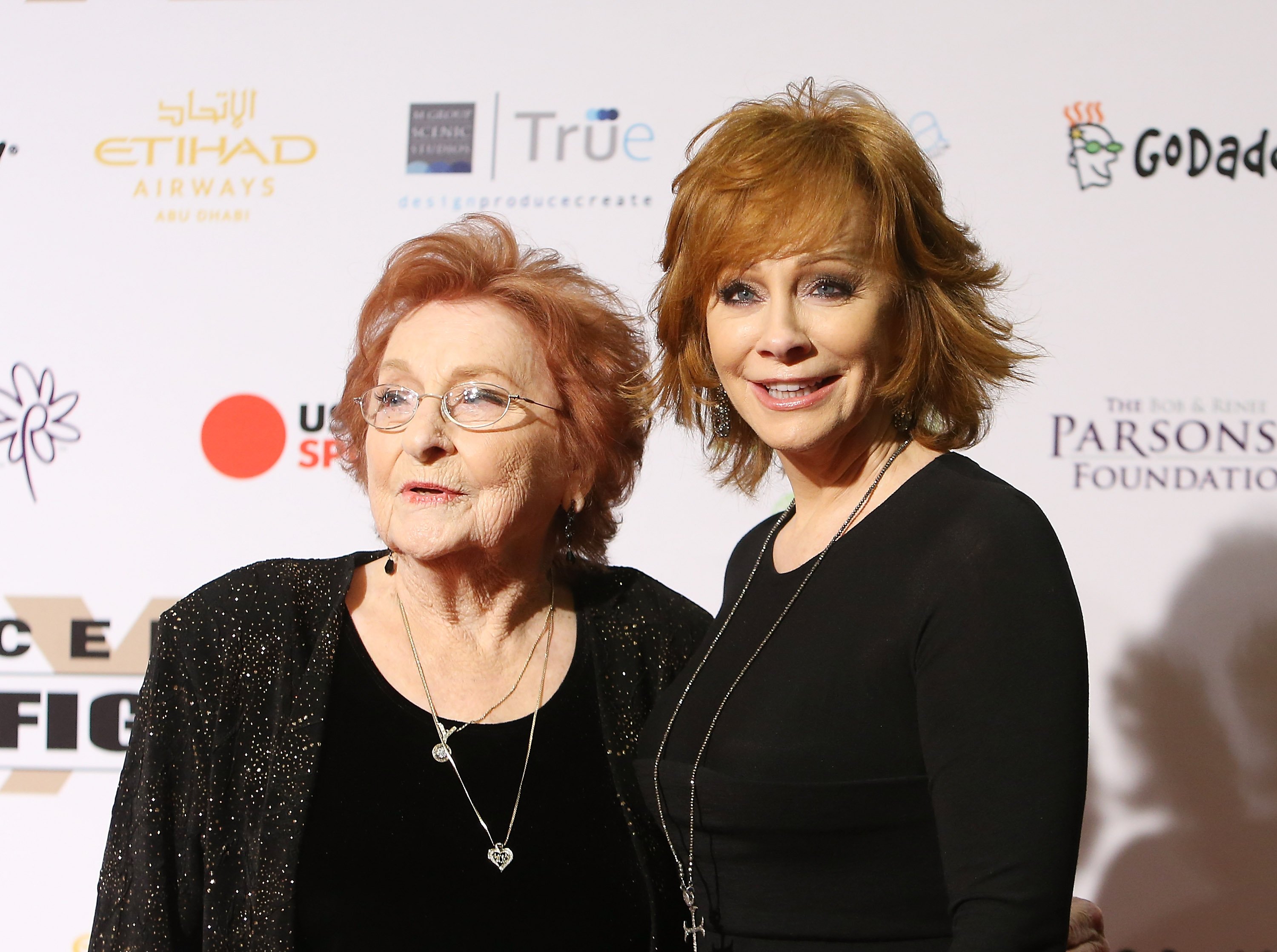  Reba McEntire (R) and Jacqueline Smith arrive at Muhammad Ali's 22nd Celebrity Fight Night held at JW Marriott Desert Ridge Resort & Spa on April 9, 2016 in Phoenix, Arizona. | Source: Getty Images