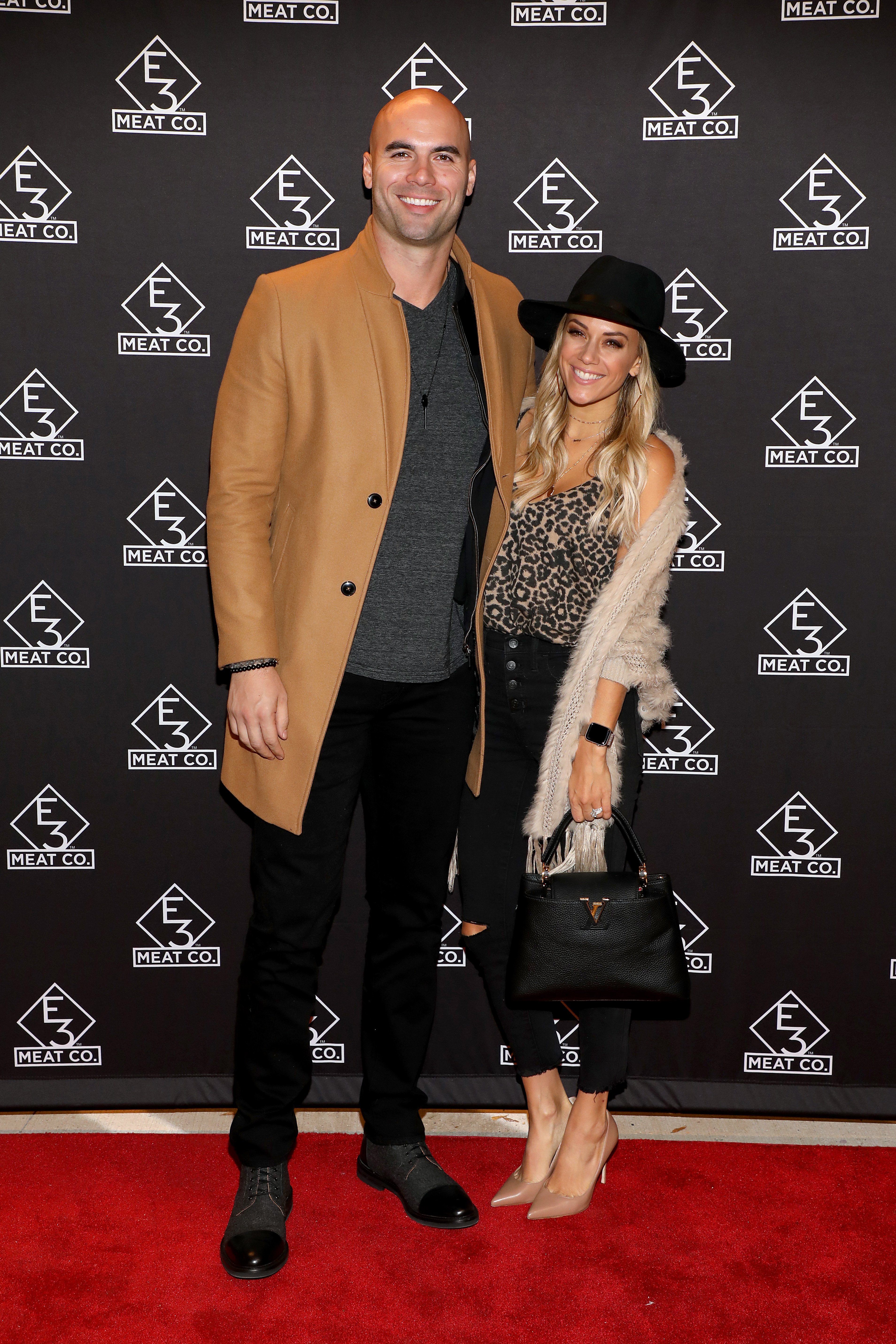 Mike Caussin and Jana Kramer pose on the red carpet at the grand opening of E3 Chophouse Nashville on November 20, 2019, in Nashville | Source: Getty Images