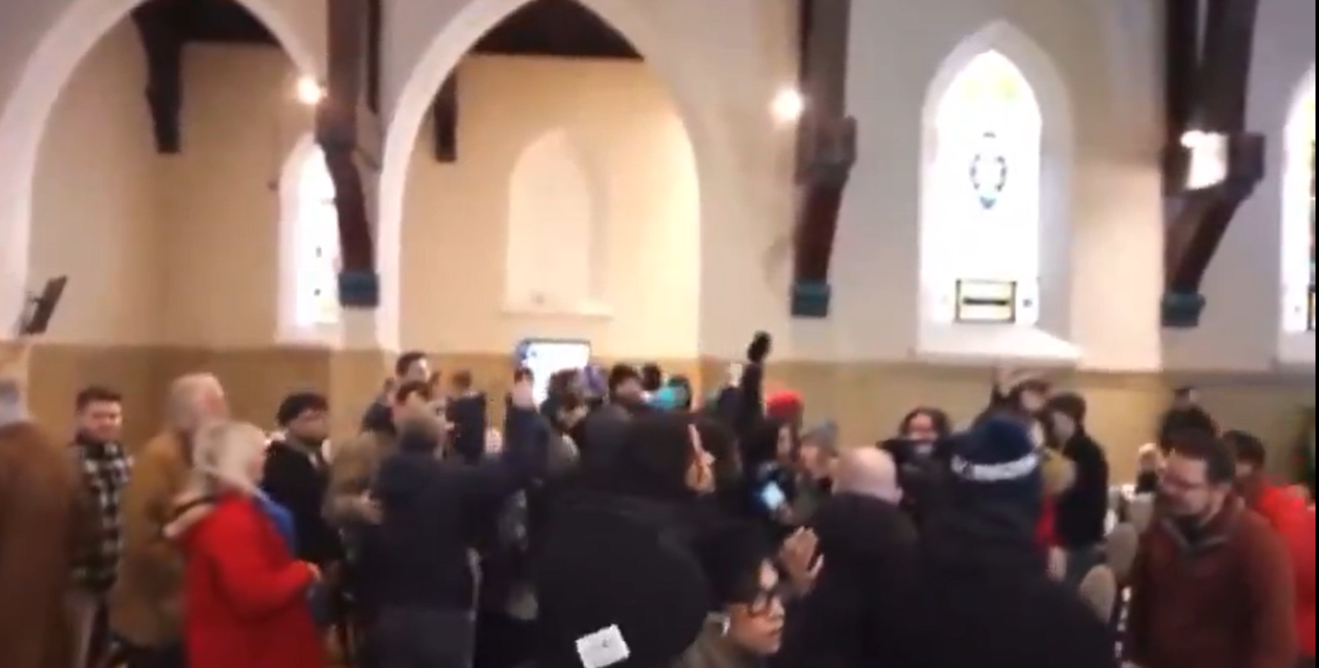 Activists in a church, as seen in a video posted on January 19, 2026 | Source: X/@CultureWar2020
