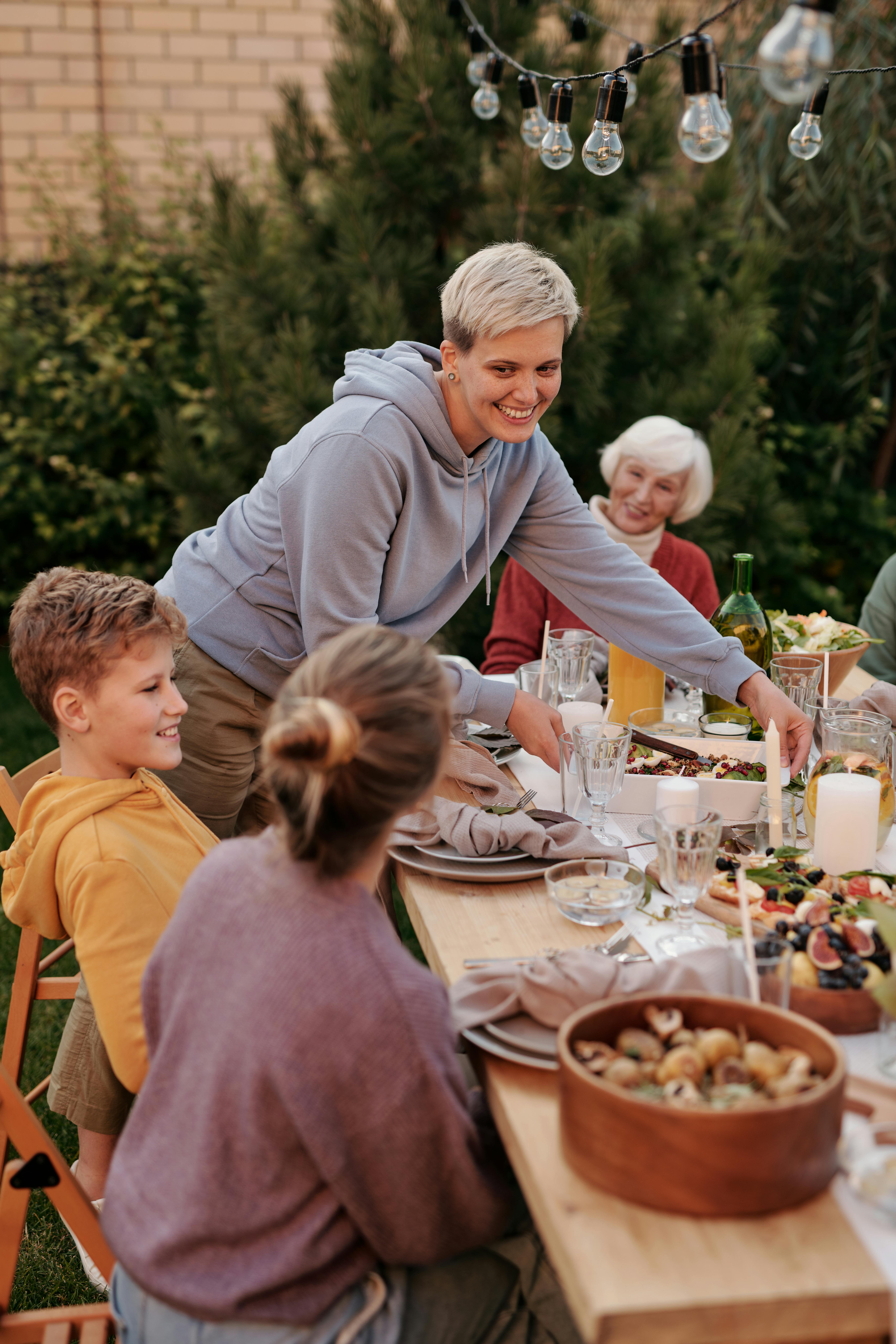 Woman at an outdoor family dinner | Source: Pexels
