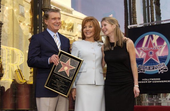 Talk show host Regis Philbin, his wife Joy and daughter JJ pose for a photograph after receiving a Star on the Hollywood Walk of Fame on April 10, 2003, in Hollywood, California. | Source: Getty Images