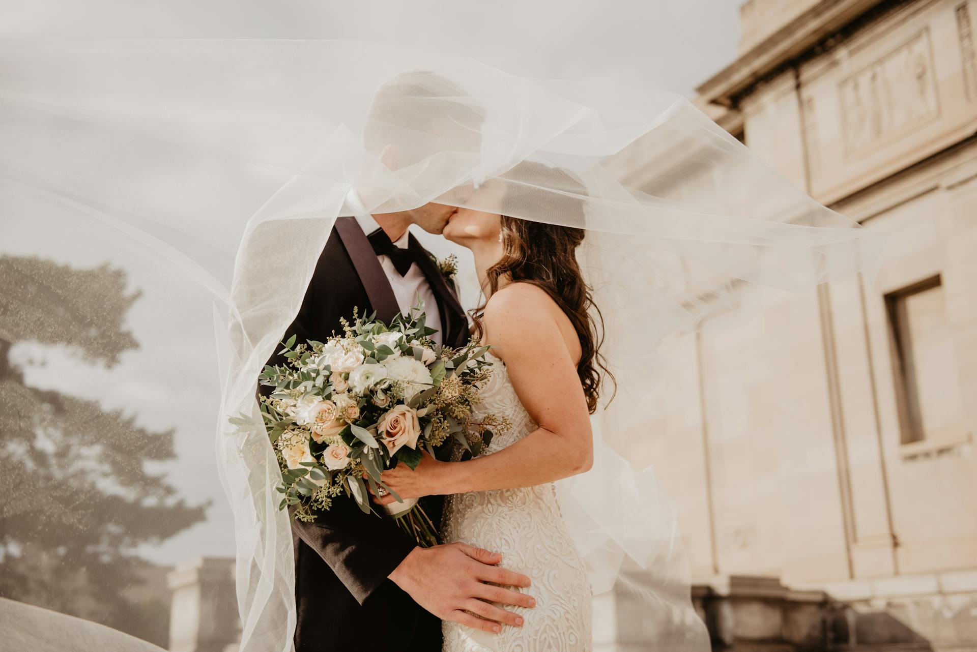 A bride and groom kissing | Source: Pexels