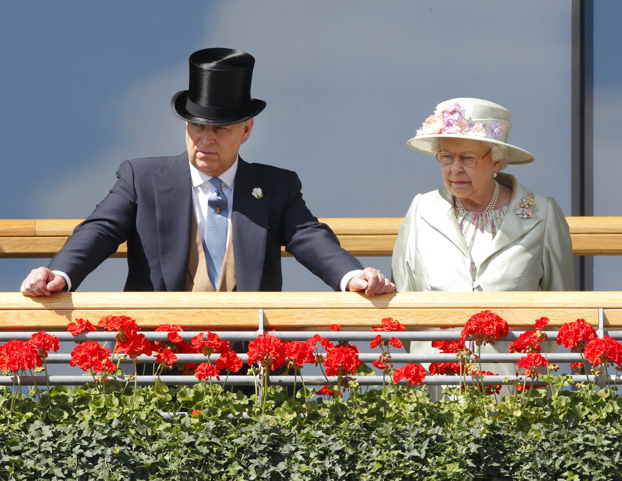 Prince Andrew, Duke of York & Queen Elizabeth II watch the horses in the parade ring as they attend Day 2 of Royal Ascot at Ascot Racecourse on June 18, 2014 in Ascot, England. | Source: Getty Images