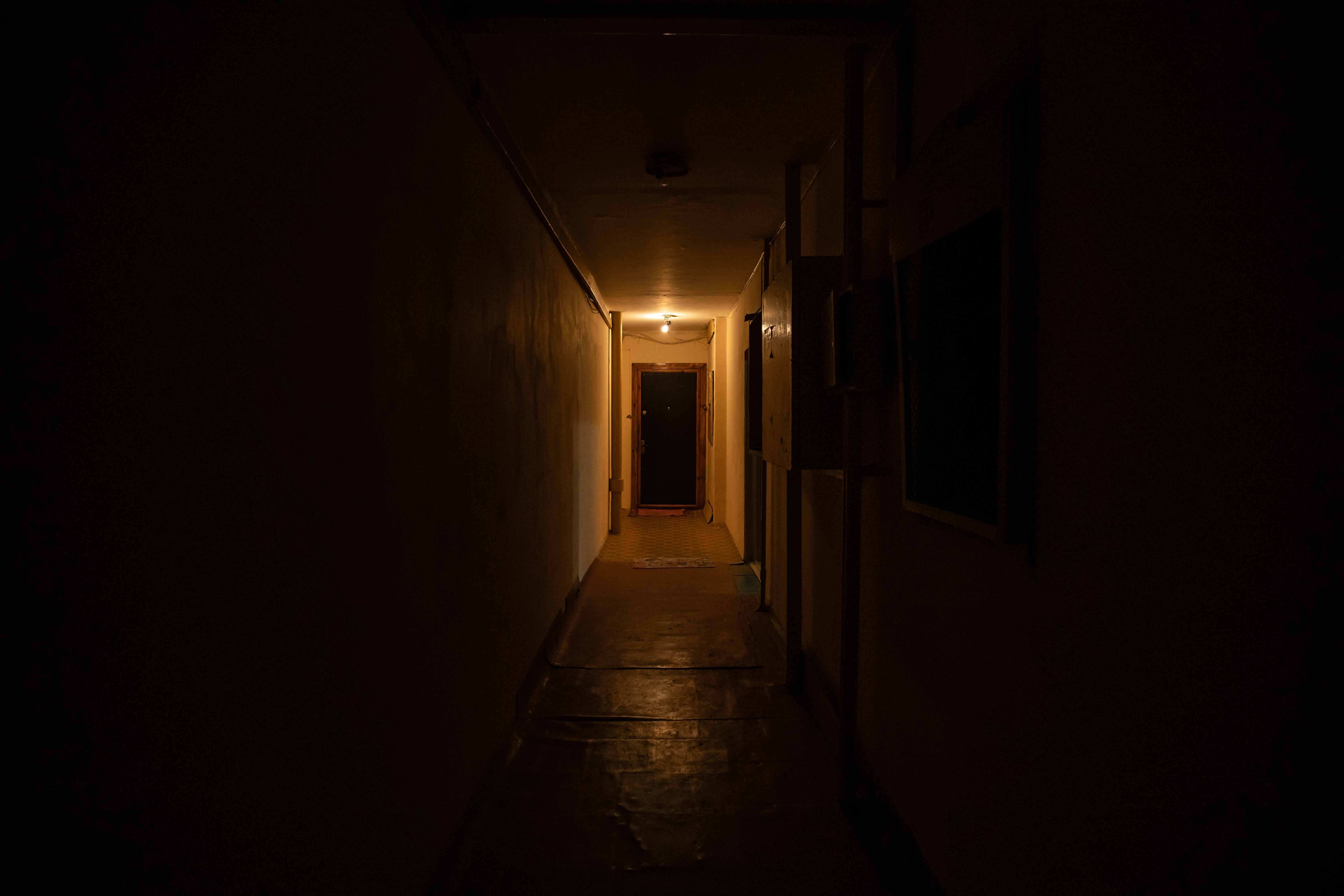 Empty dark corridor with light at the end | Source: Shutterstock.com