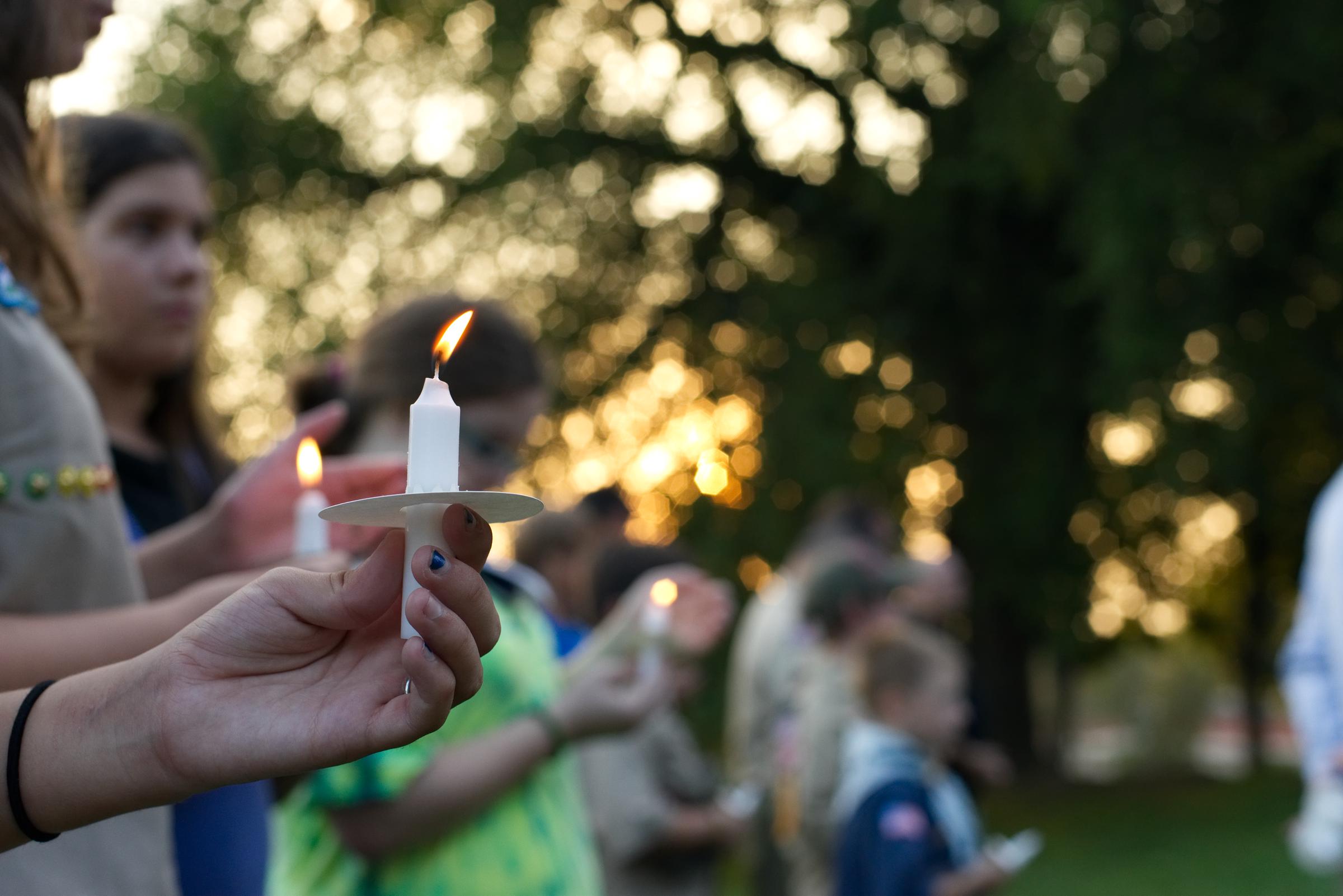 A community holding a candle light ceremony | Source: Getty Images