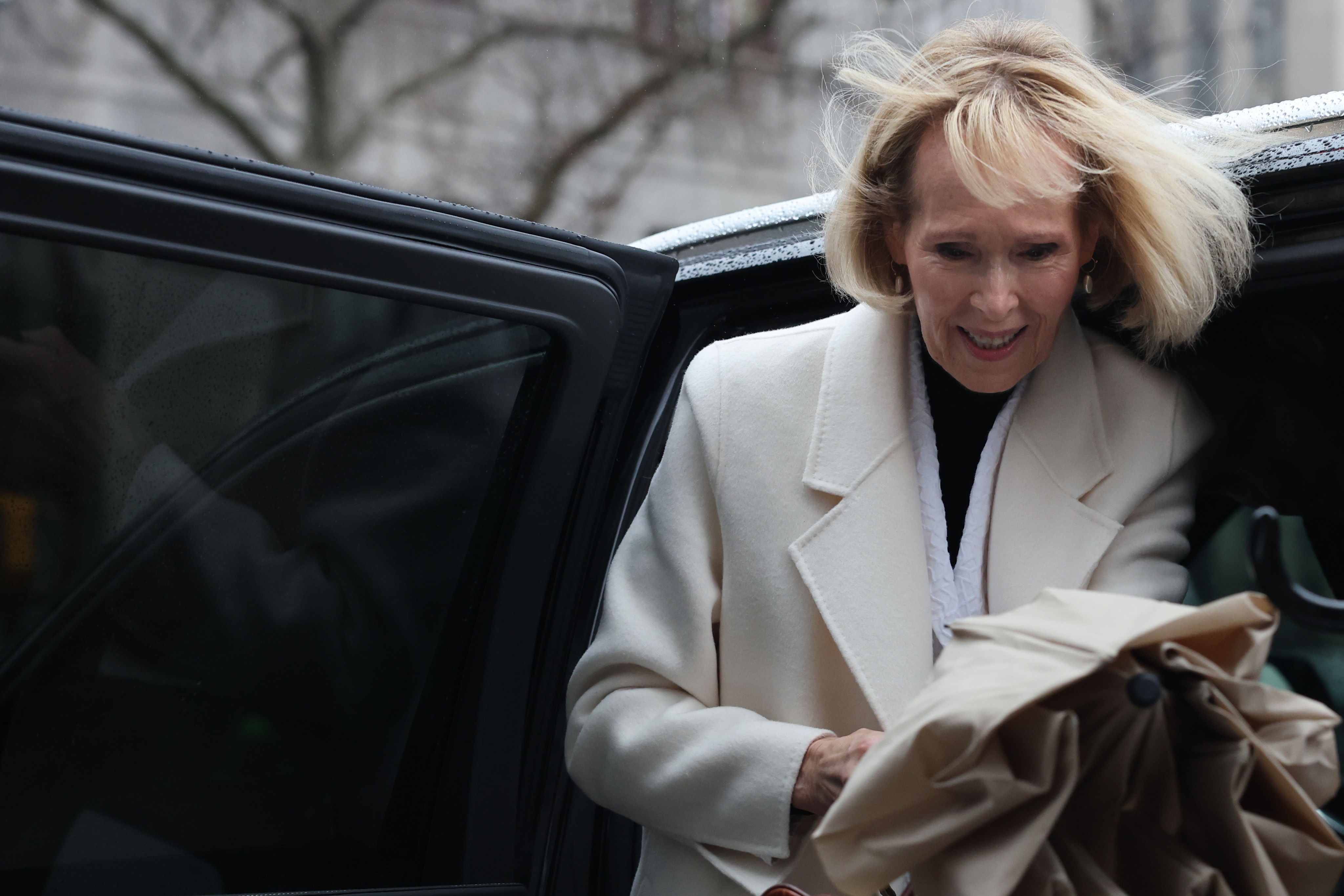E. Jean Carroll arrives outside court in New York during one of the high-profile legal proceedings that ultimately resulted in President Donald Trump paying more than $5.6 million in damages after years of appeals. | Source: Getty Images