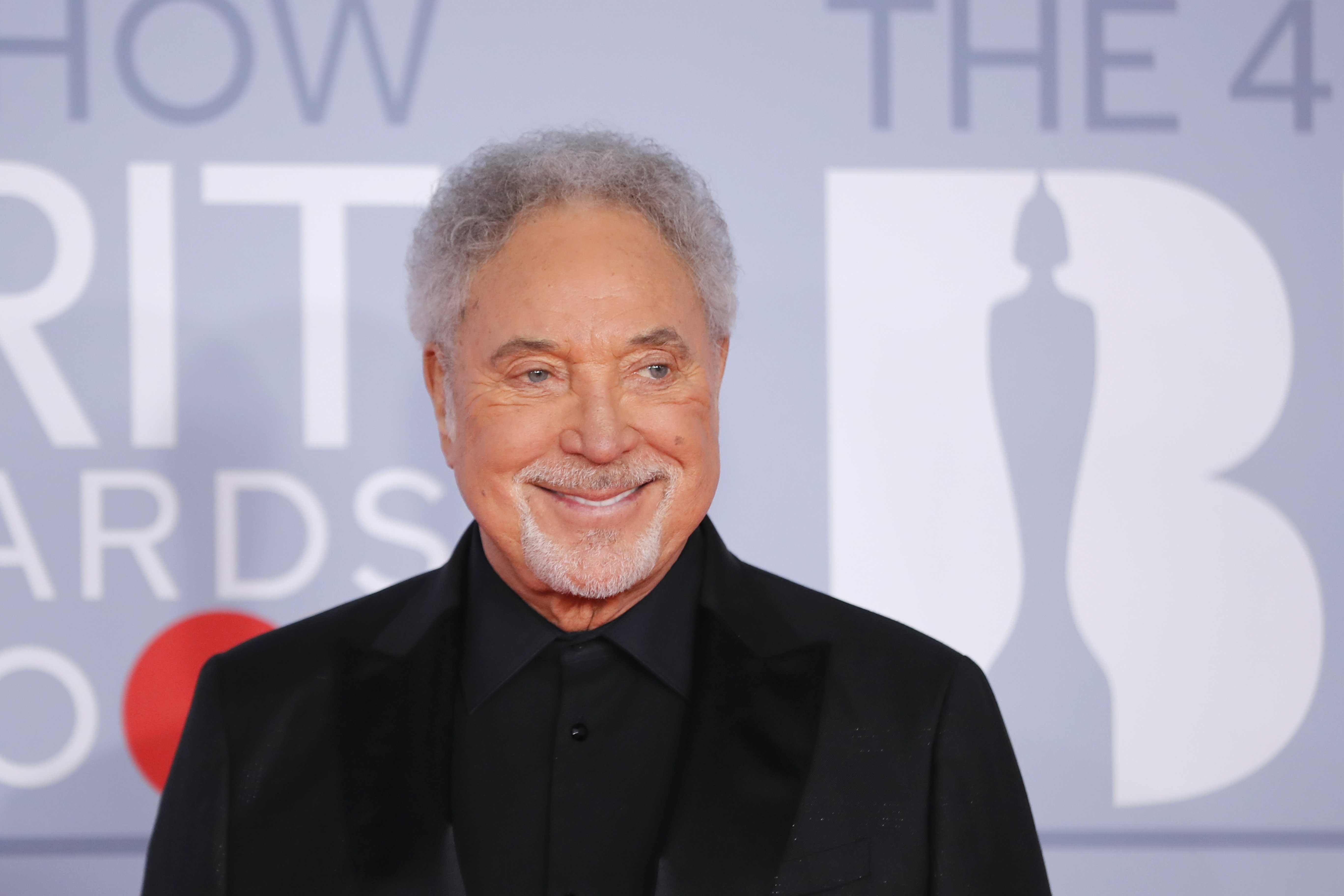 British singer Tom Jones poses on the red carpet on arrival for the BRIT Awards 2020 in London on February 18, 2020 | Source: Getty Images