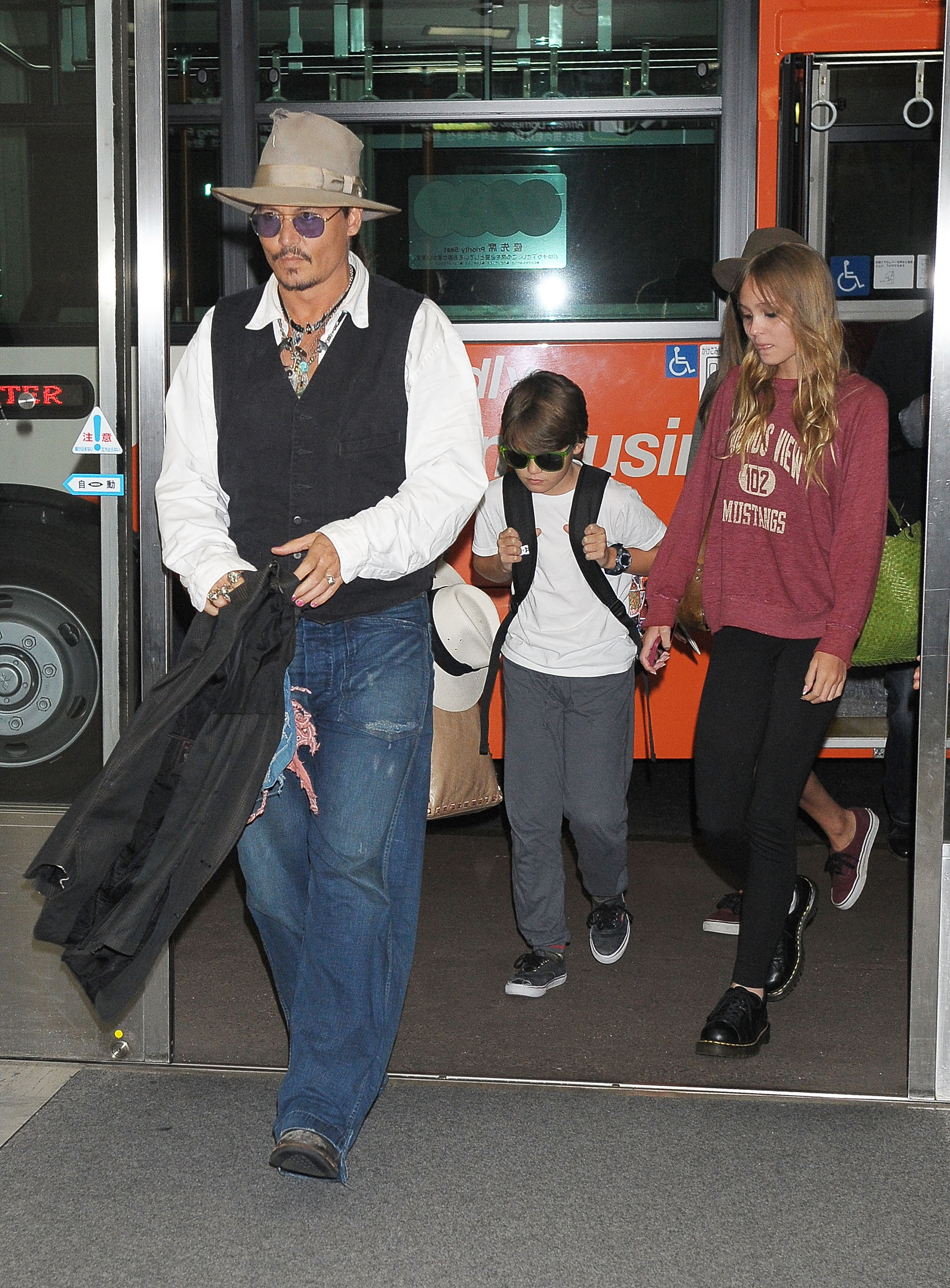 Johnny Depp, Jack Depp, and Lily-Rose Melody Depp pictured arriving at Narita International Airport on July 16, 2013 in Narita, Japan. | Source: Getty Images