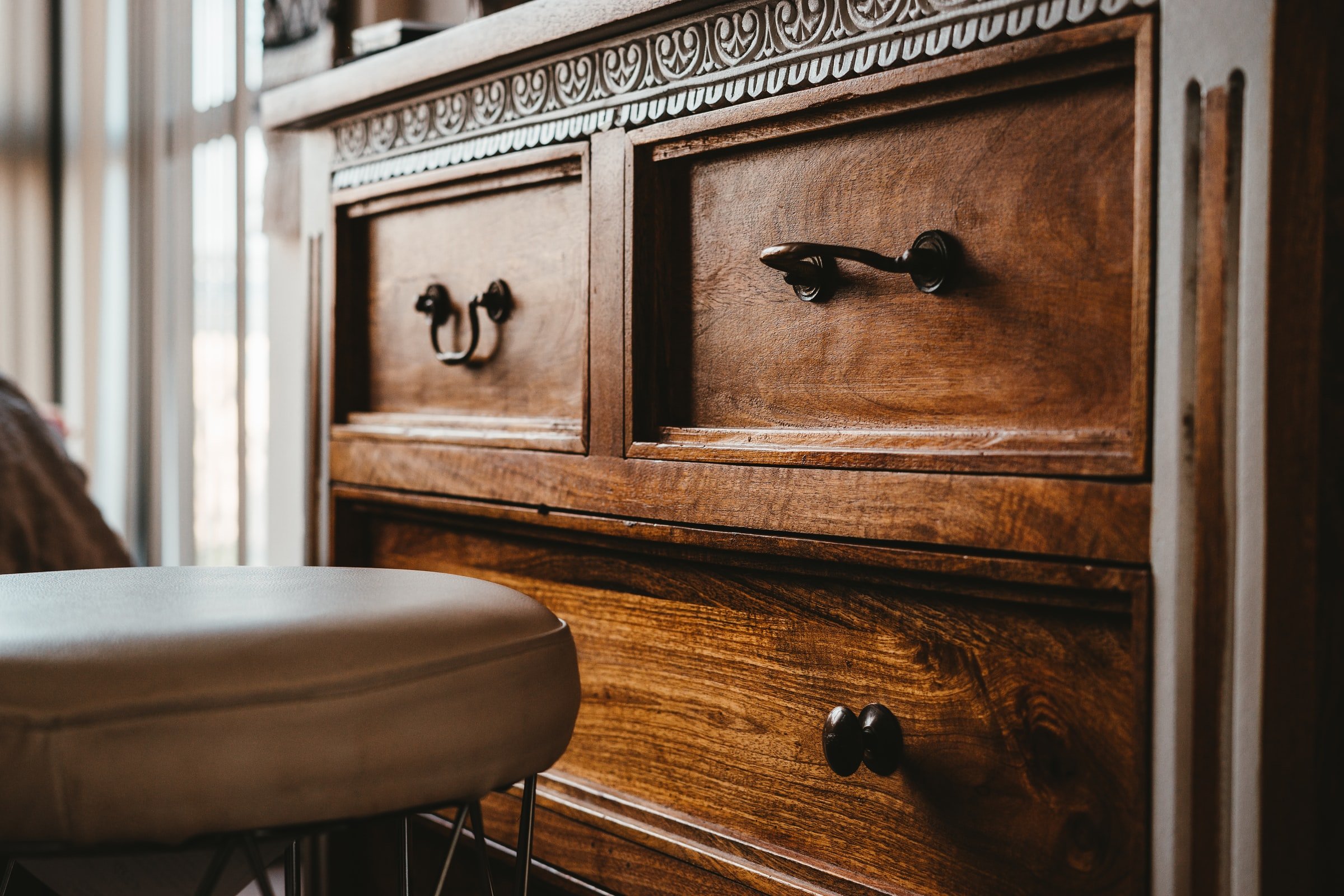Close-up of a wooden dresser. | Source: Unsplash