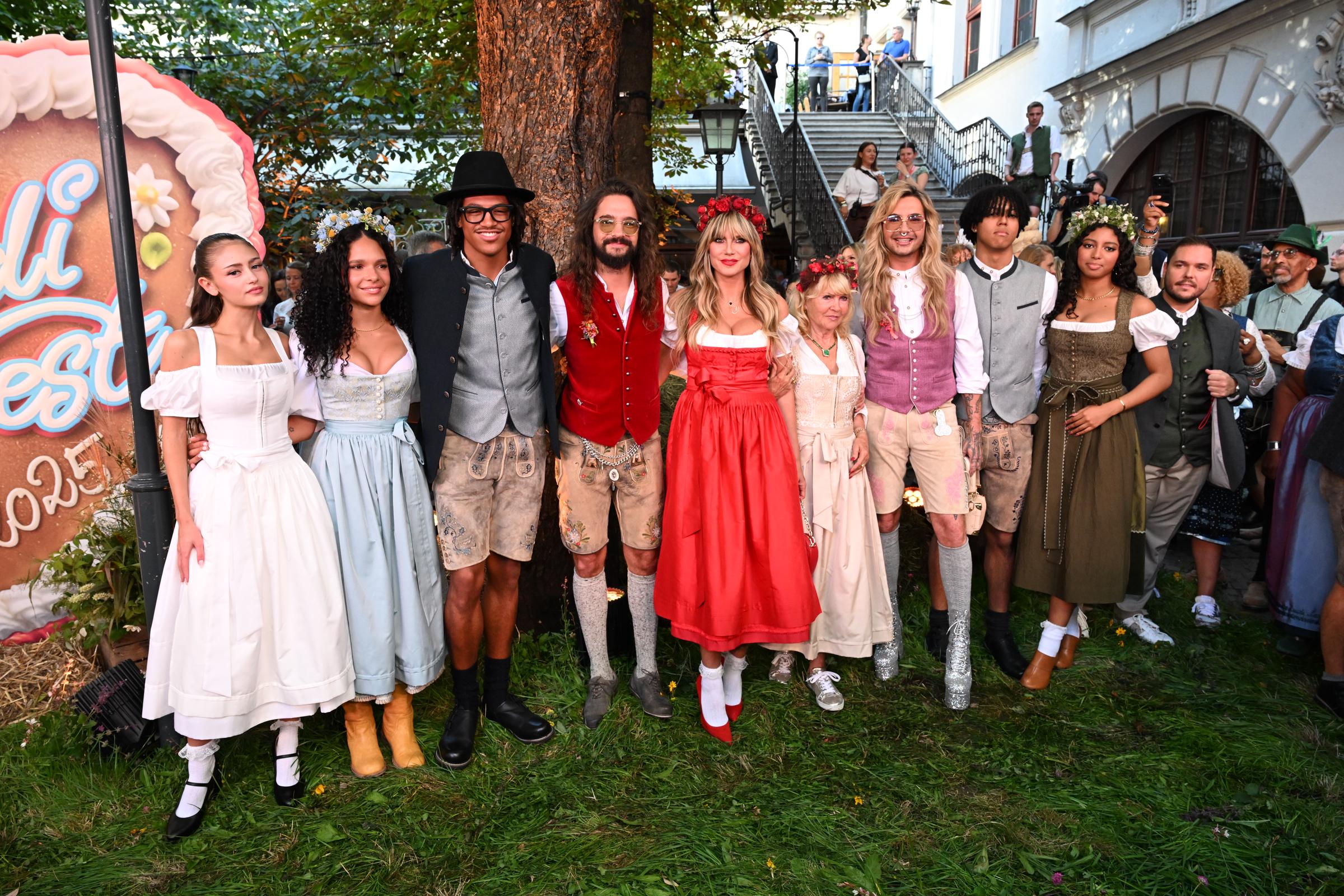 Leni Klum, Kayla Betulius, Henry Samuel, Tom Kaulitz, Heidi Klum, Erna Klum, Bill Kaulitz, Johan Samuel and Lou Klum on the red carpet for Heidifest on September 18, 2025, in Munich, Germany. | Source: Getty Images