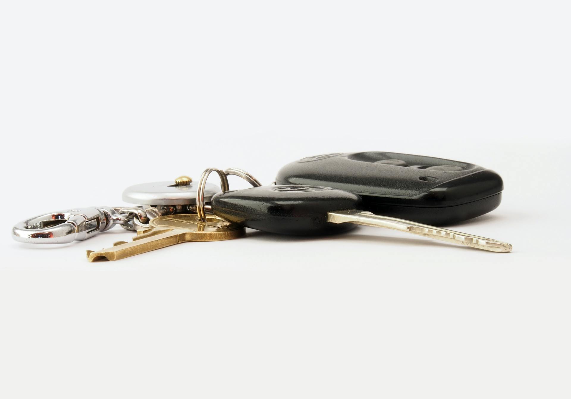 Car keys lying on a white surface | Source: Pexels