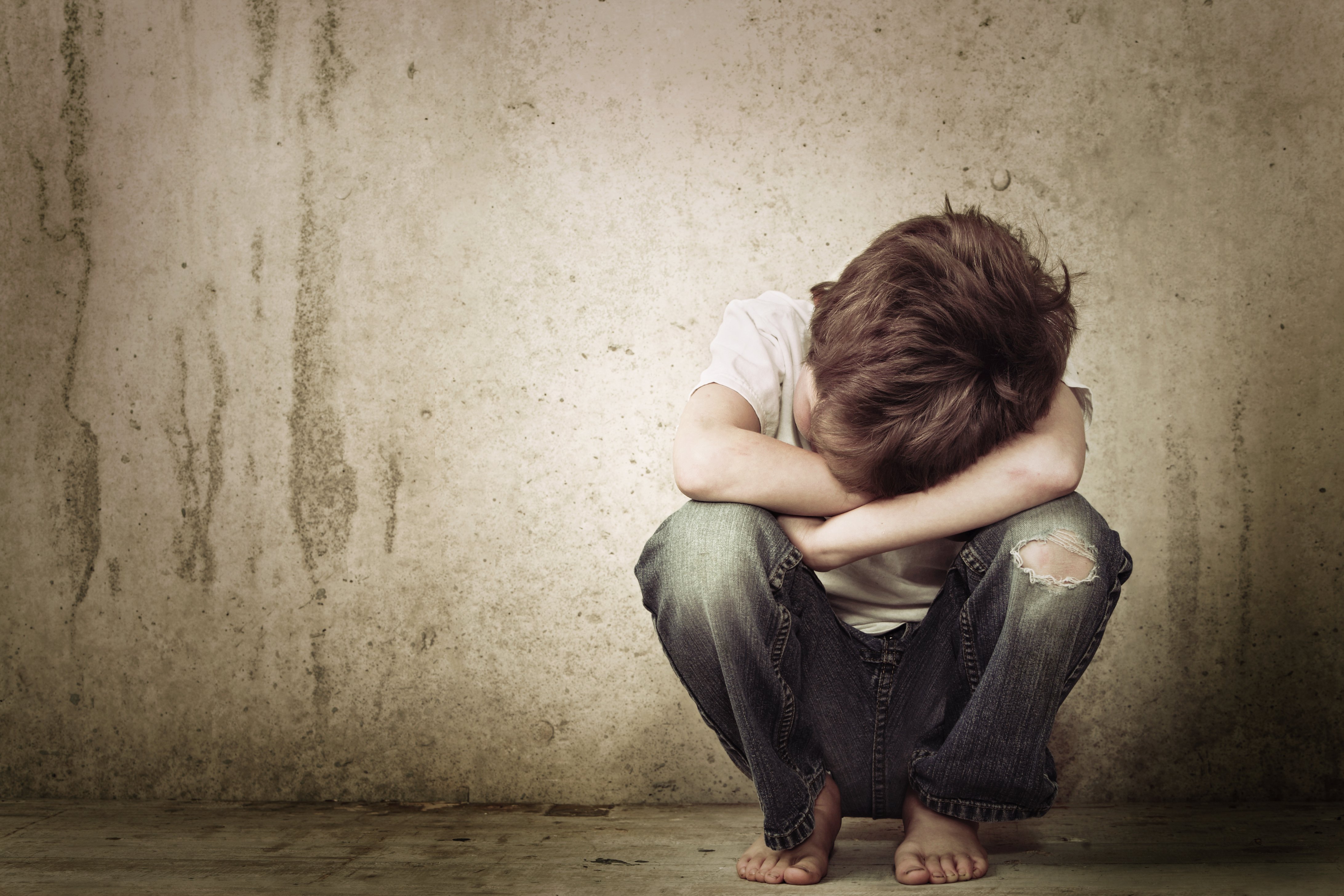 Sad boy crying in the corner. | Source: Shutterstock