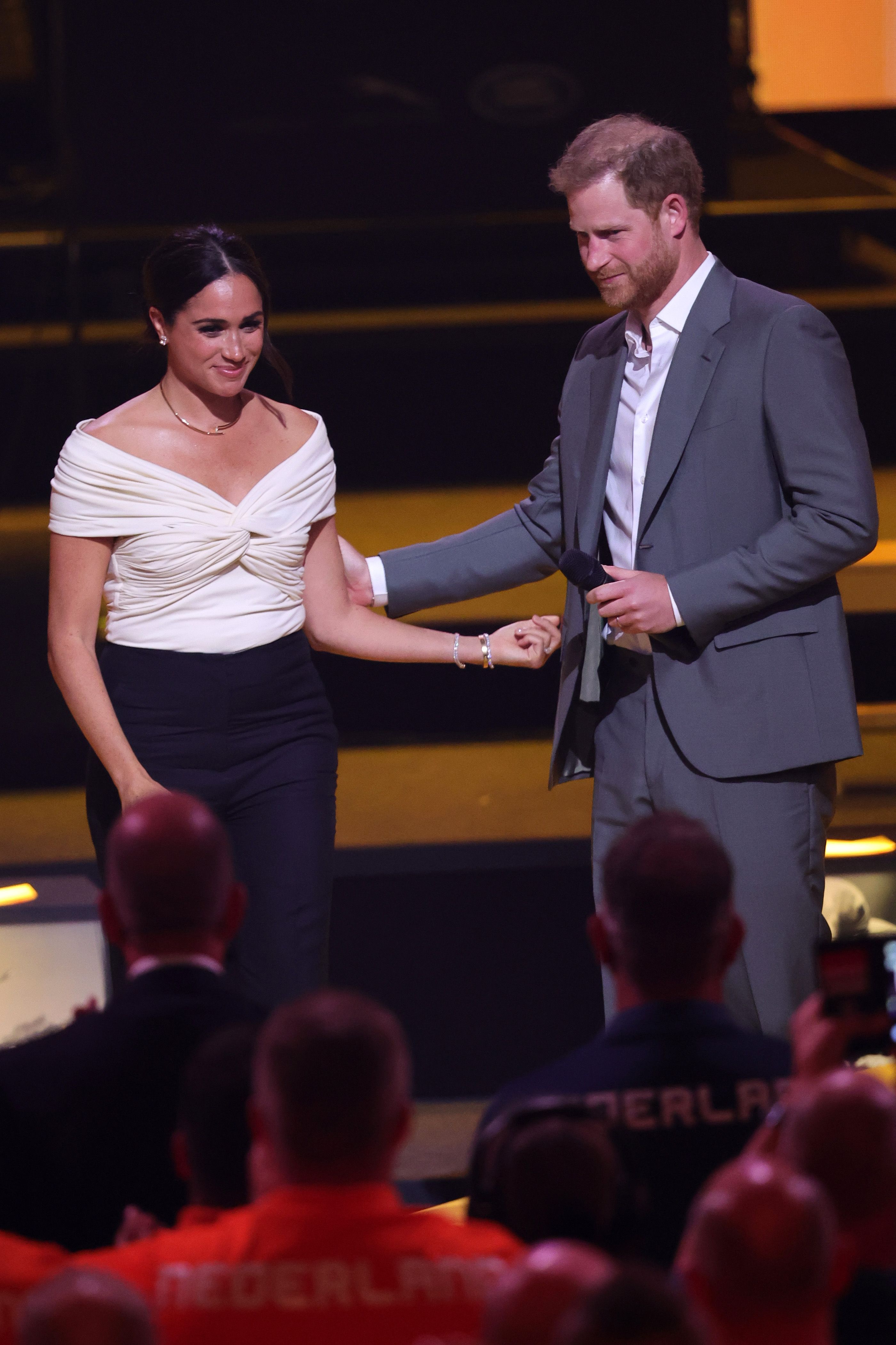  Prince Harry, Duke of Sussex and Meghan, Duchess of Sussex are seen on stage during the Invictus Games The Hague 2020 Opening Ceremony at Zuiderpark on April 16, 2022 in The Hague, Netherlands | Source: Getty Images