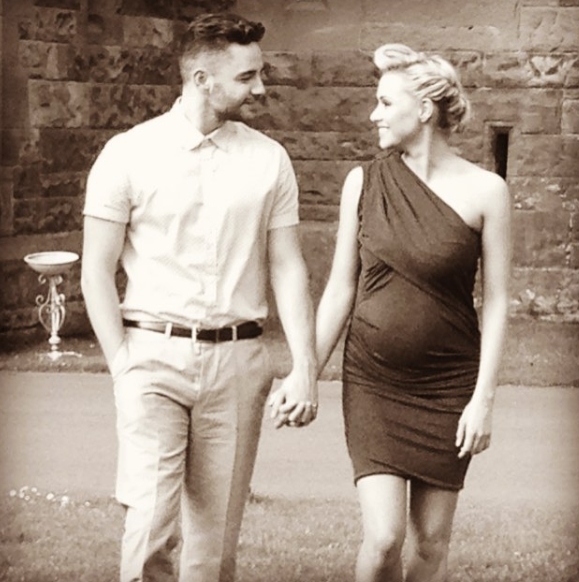 Captured on 9 August 2016, Adam and Caroline Thomas walk hand in hand in this softly toned image, with Caroline visibly expecting, as they share a warm glance — a tender moment that reflects both their growing family and the strength of their relationship. | Source: Instagram/carolinethomas23