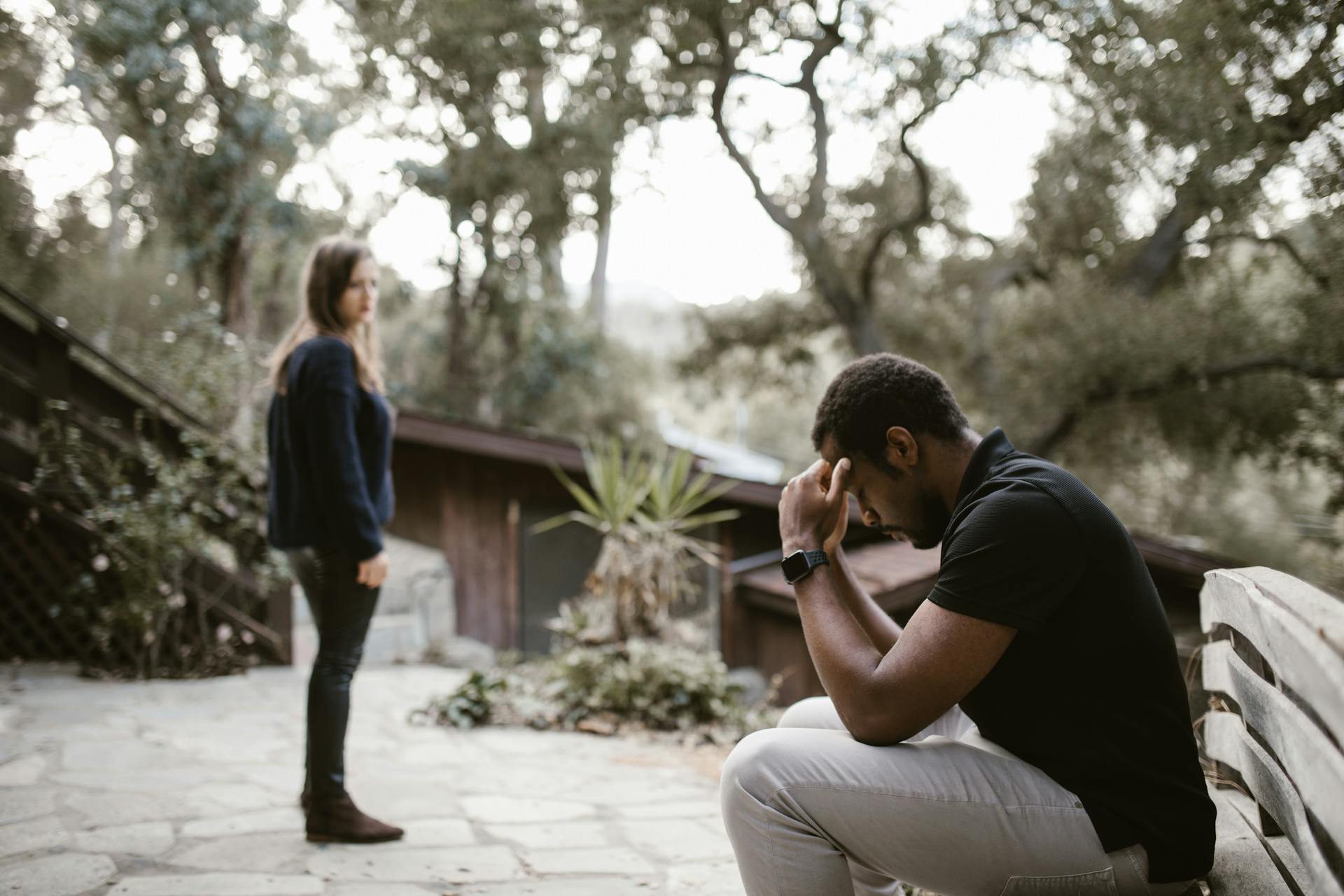 A woman looking at a stressed man | Source: Pexels