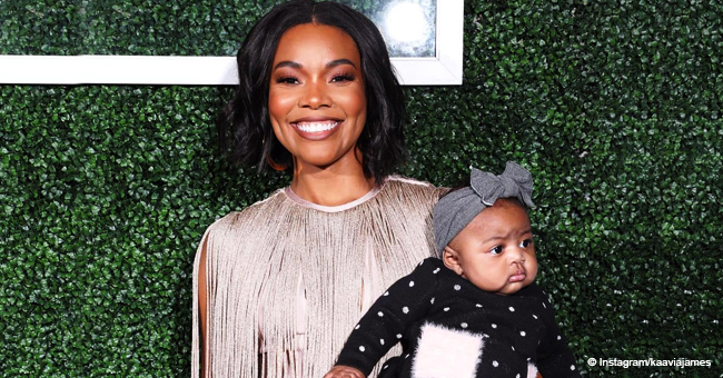 Gabrielle Union's Daughter Has Hilarious Staredown with Family Dog in Adorable Picture
