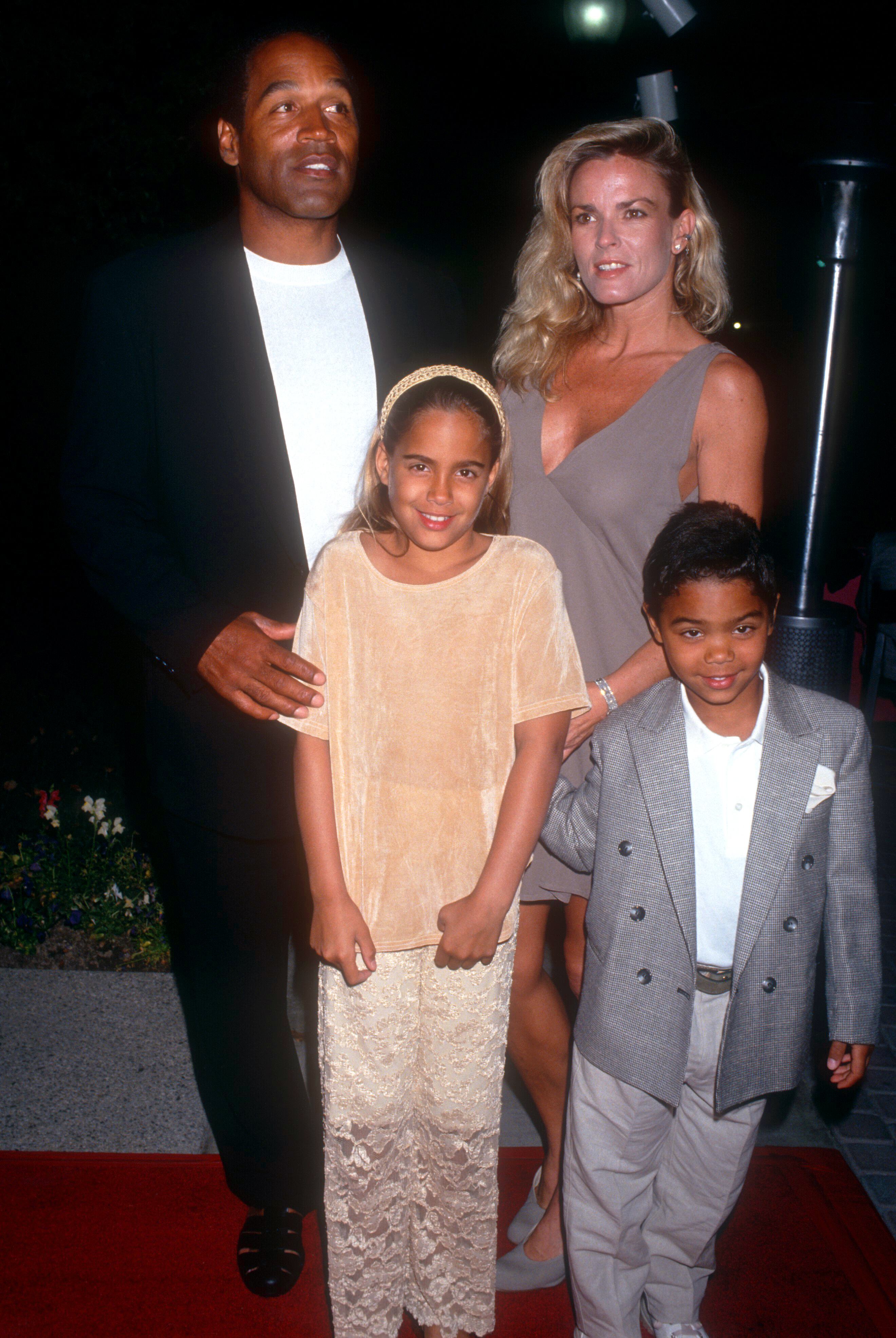 O.J. Simpson and Nicole Brown Simpson walk the red carpet with their children, Sydney and Justin, as they attend the "Naked Gun 33 1/3: The Final Insult" premiere on March 16, 1994, at the Paramount Studios in Hollywood, California. | Source: Getty Images