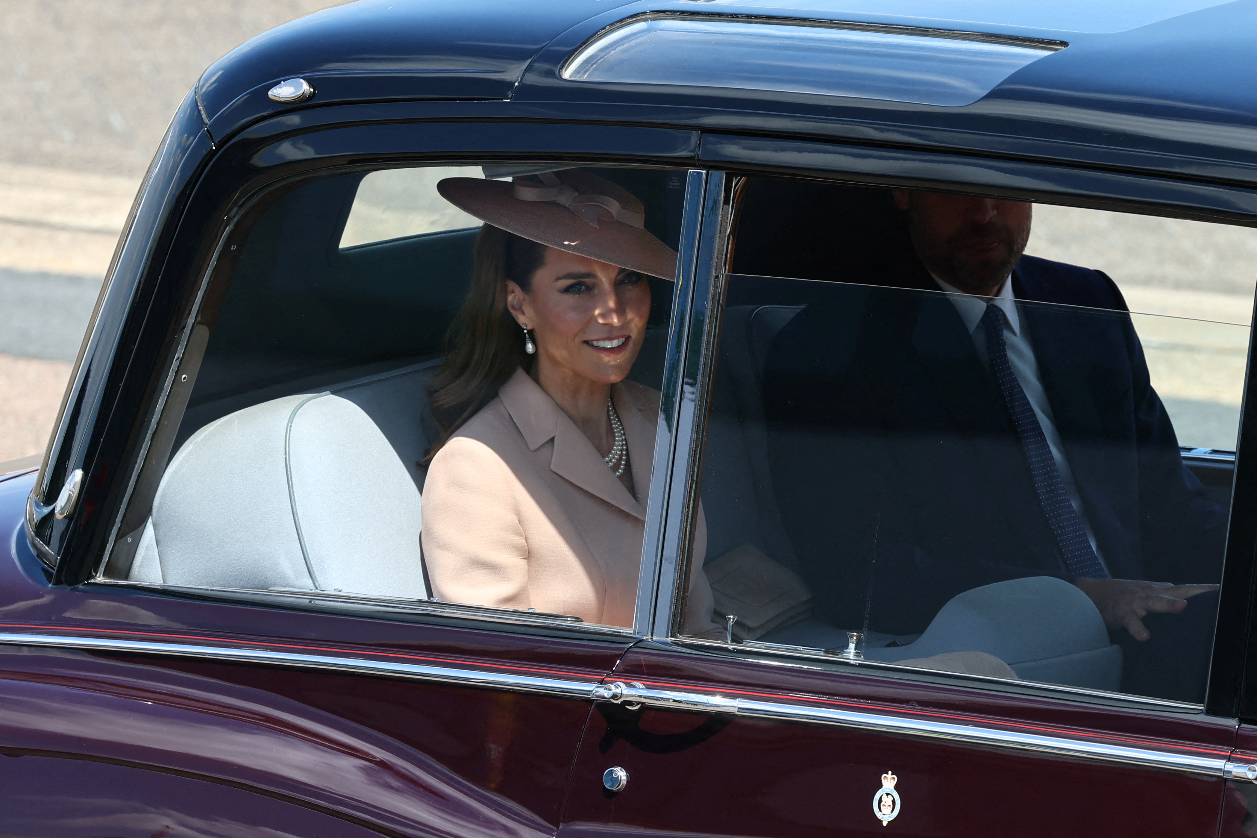 Princess Catherine and Prince William depart RAF Northolt by car after greeting French President Emmanuel Macron and his wife, Brigitte Macron.