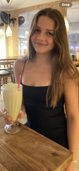 Smiling warmly while enjoying a milkshake, Ellie Hague appears relaxed and full of life in this candid moment. The sixth-form student from Sherburn in Elmet was tragically killed in a minibus crash near Tadcaster on December 1, 2025, leaving her community devastated. | Source: Facebook/North Yorkshire Police