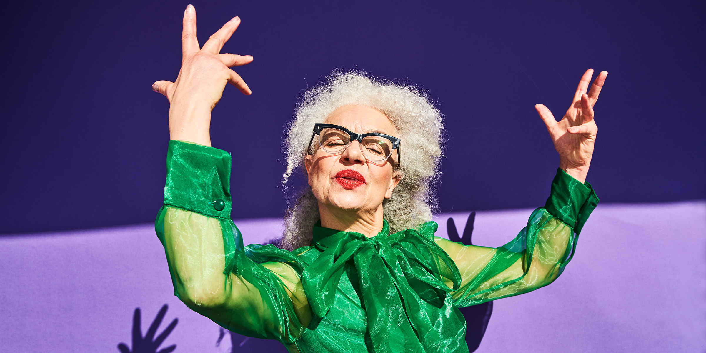 A whimsical older woman posing for a photo | Source: Getty Images