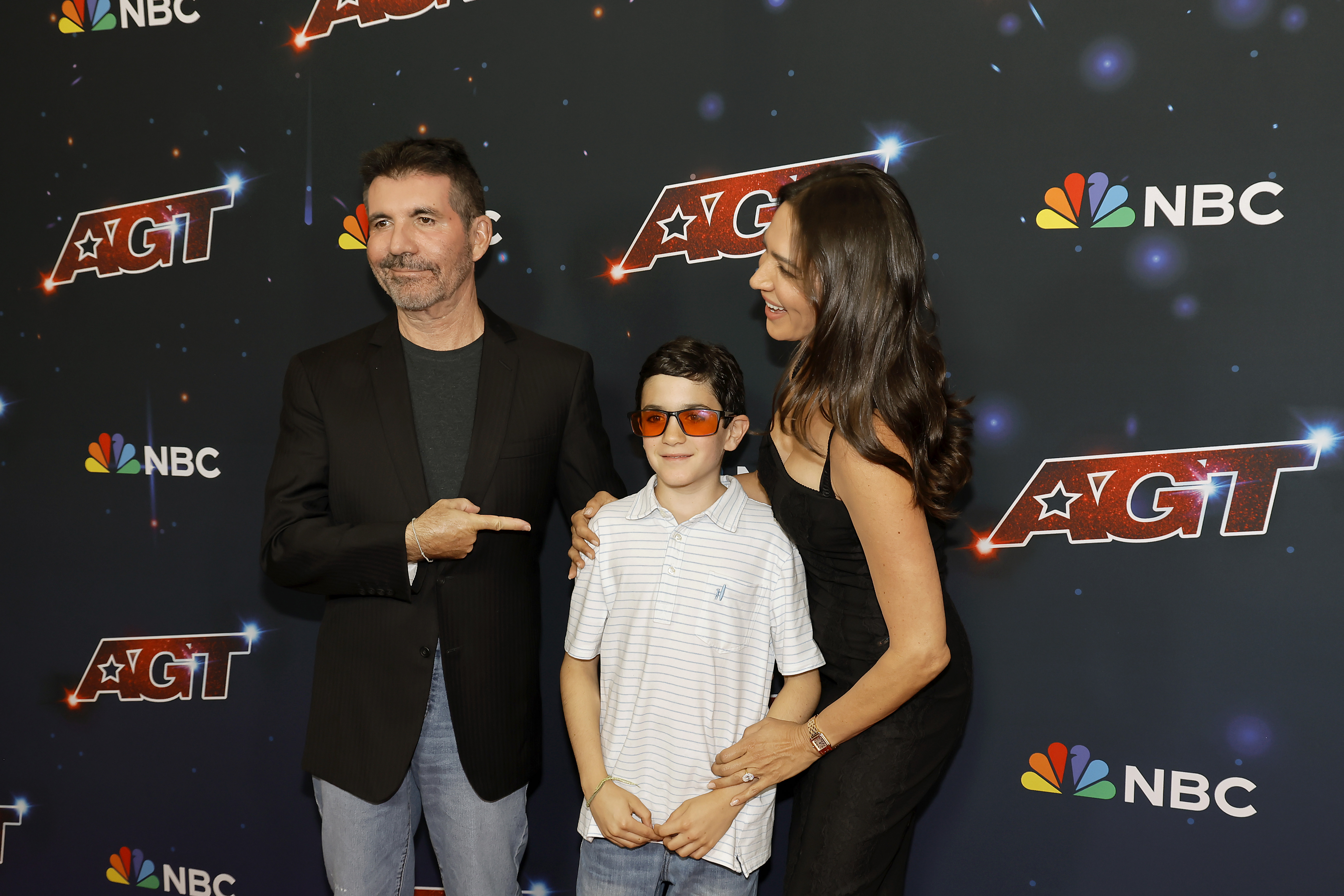 Simon Cowell, Lauren Silverman, and their son Eric attend the red carpet for the “America’s Got Talent” Season 18 finale in California, on September 27, 2023 | Getty Images