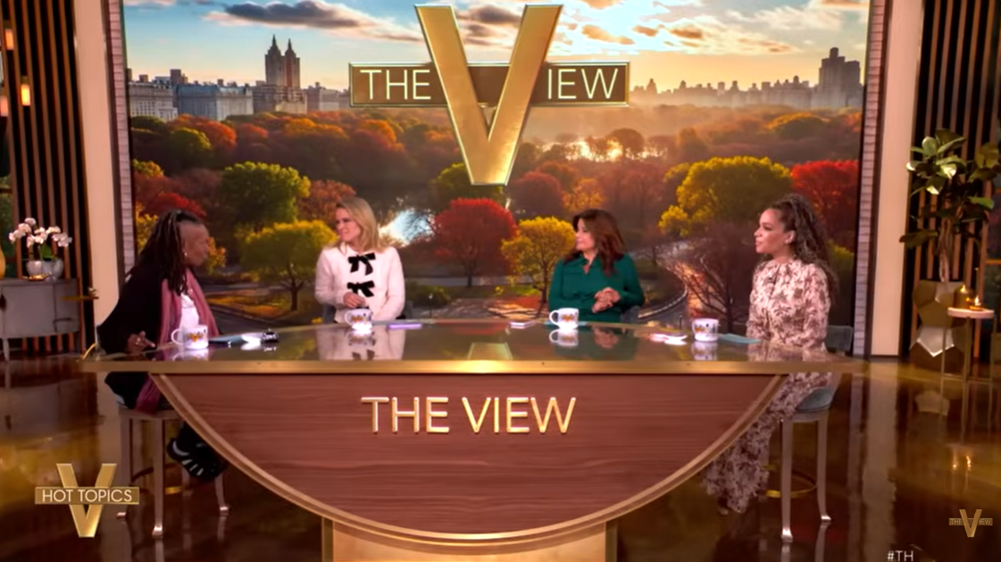 Whoopi Goldberg rejoins her co-hosts at The View table during her first appearance back on the show, which aired on December 1, 2025 | Source: YouTube/TheView