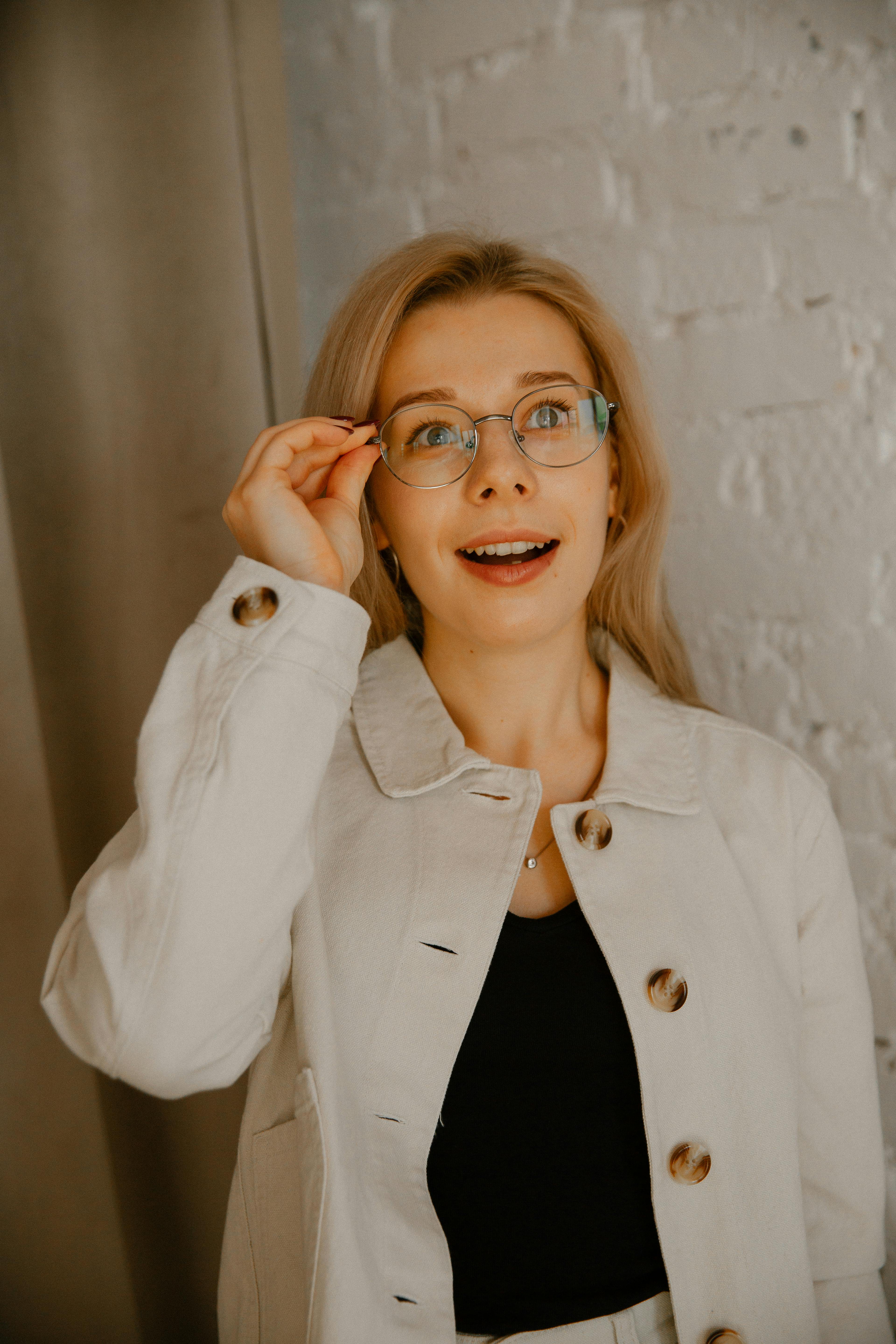 A smiling woman with glasses | Source: Pexels