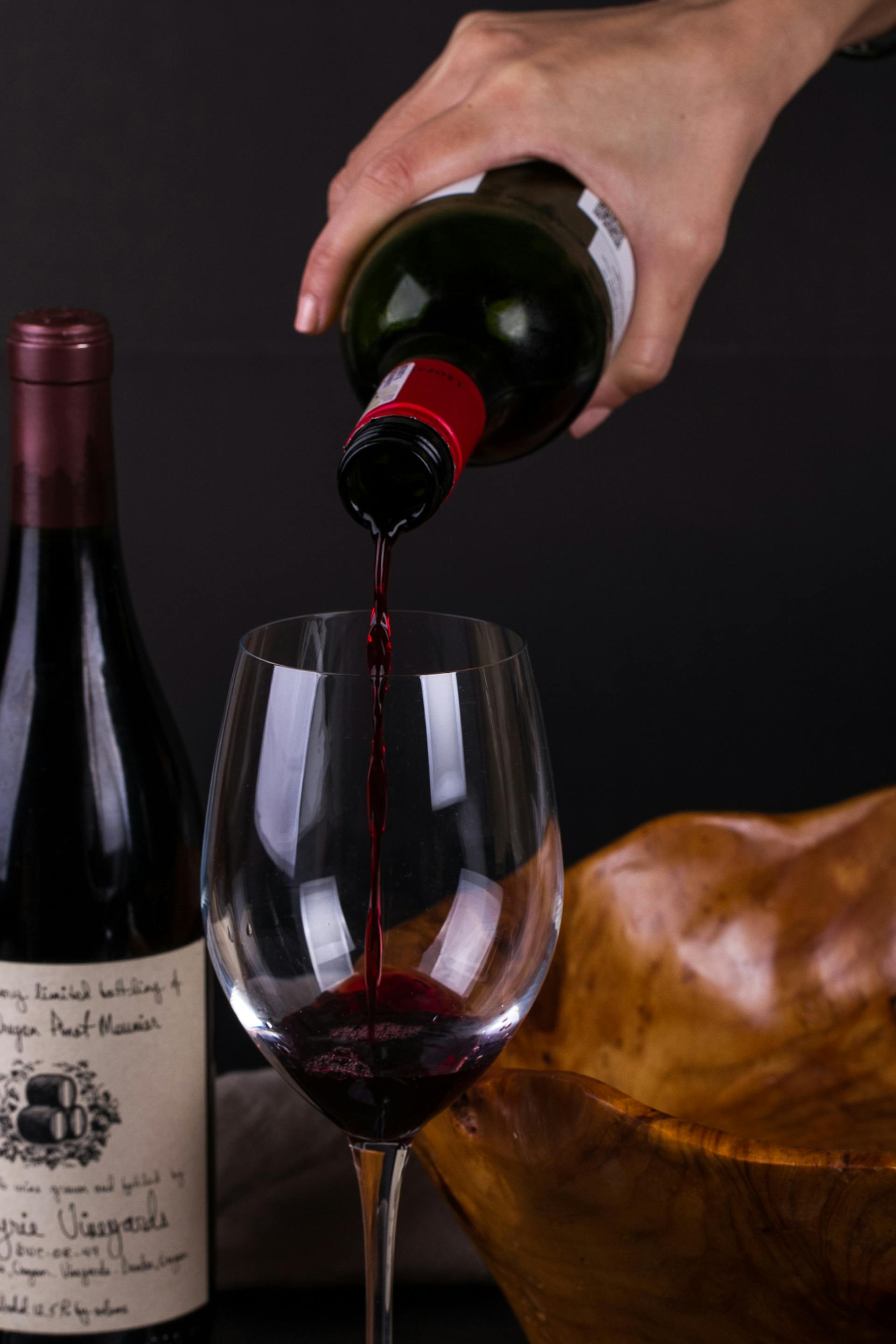 A person pouring wine | Source: Pexels