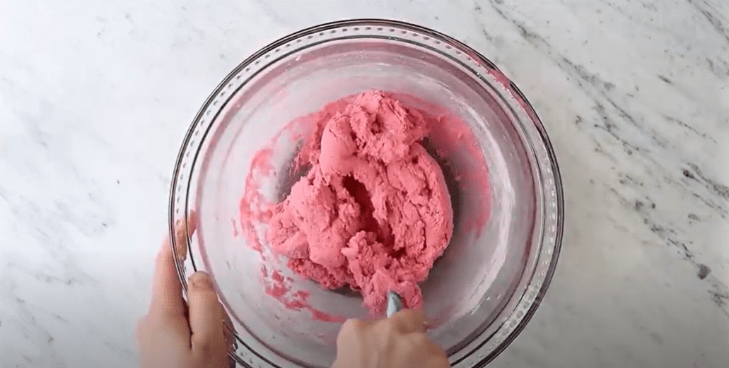 Person mixing the ingredients. | Photo: YouTube/thefirstyear