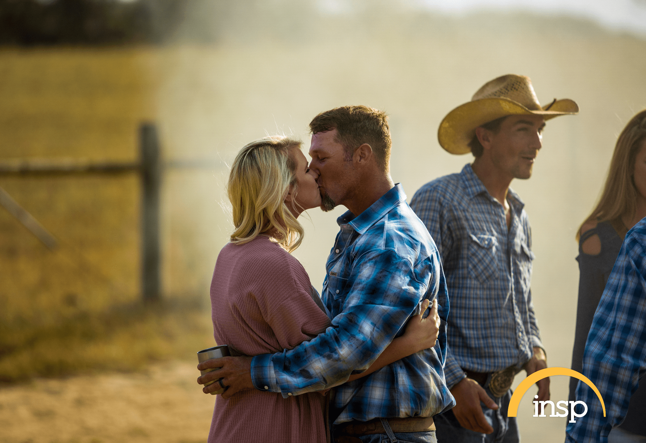 "The Cowboy Way" star Bubba Thompson and his wife Kaley kiss in a photograph. | Source: INSP