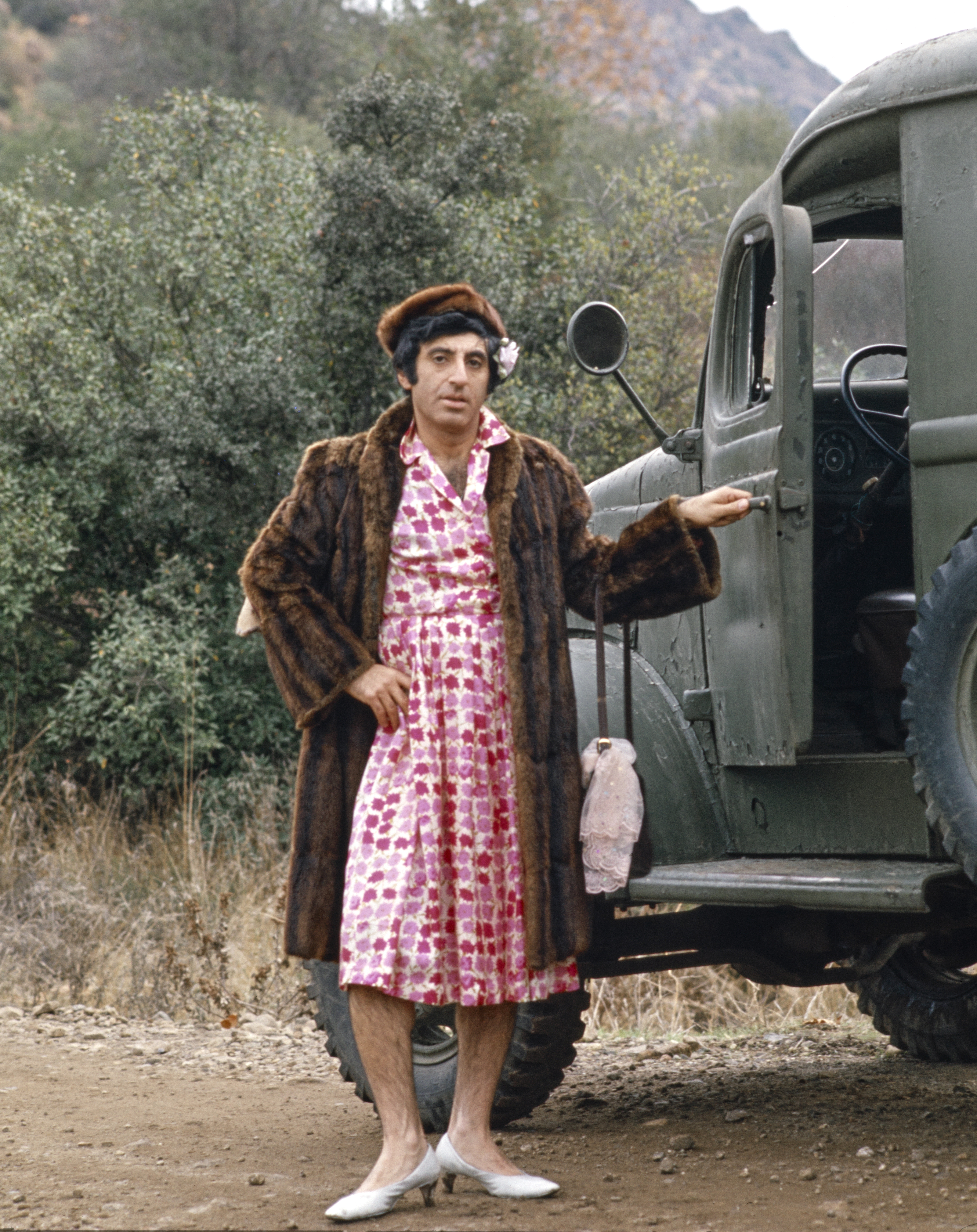 Actor Jamie Farr as Corporal Maxwell Q. Klinger on the CBS television sitcom, "M*A*S*H" on January 1, 1977 | Source: Getty Images