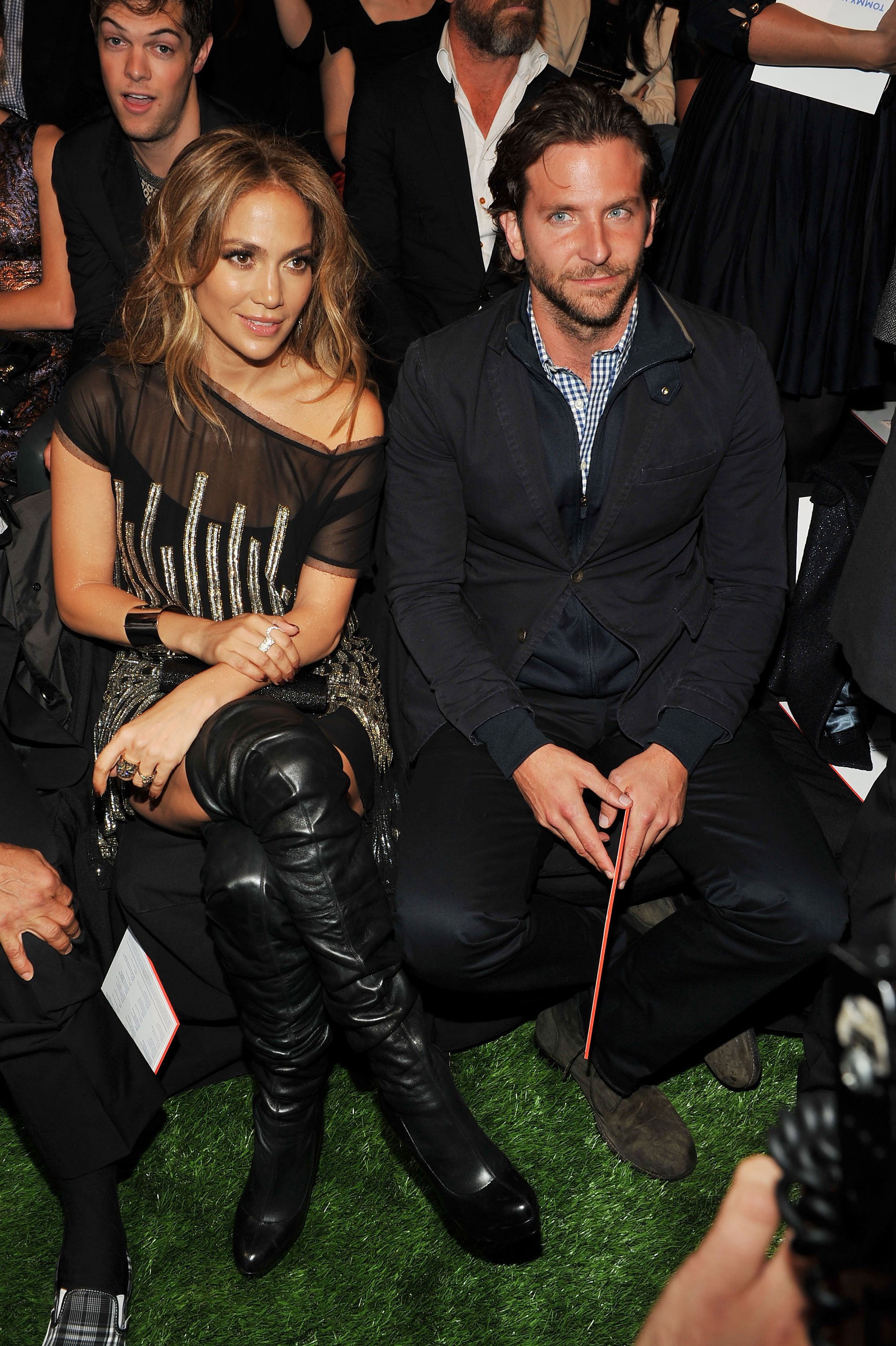 Bradley Cooper and Jennifer Lopez at the Tommy Hilfiger Spring 2011 Men's and Women's show on September 12, 2010 | Source: Getty Images