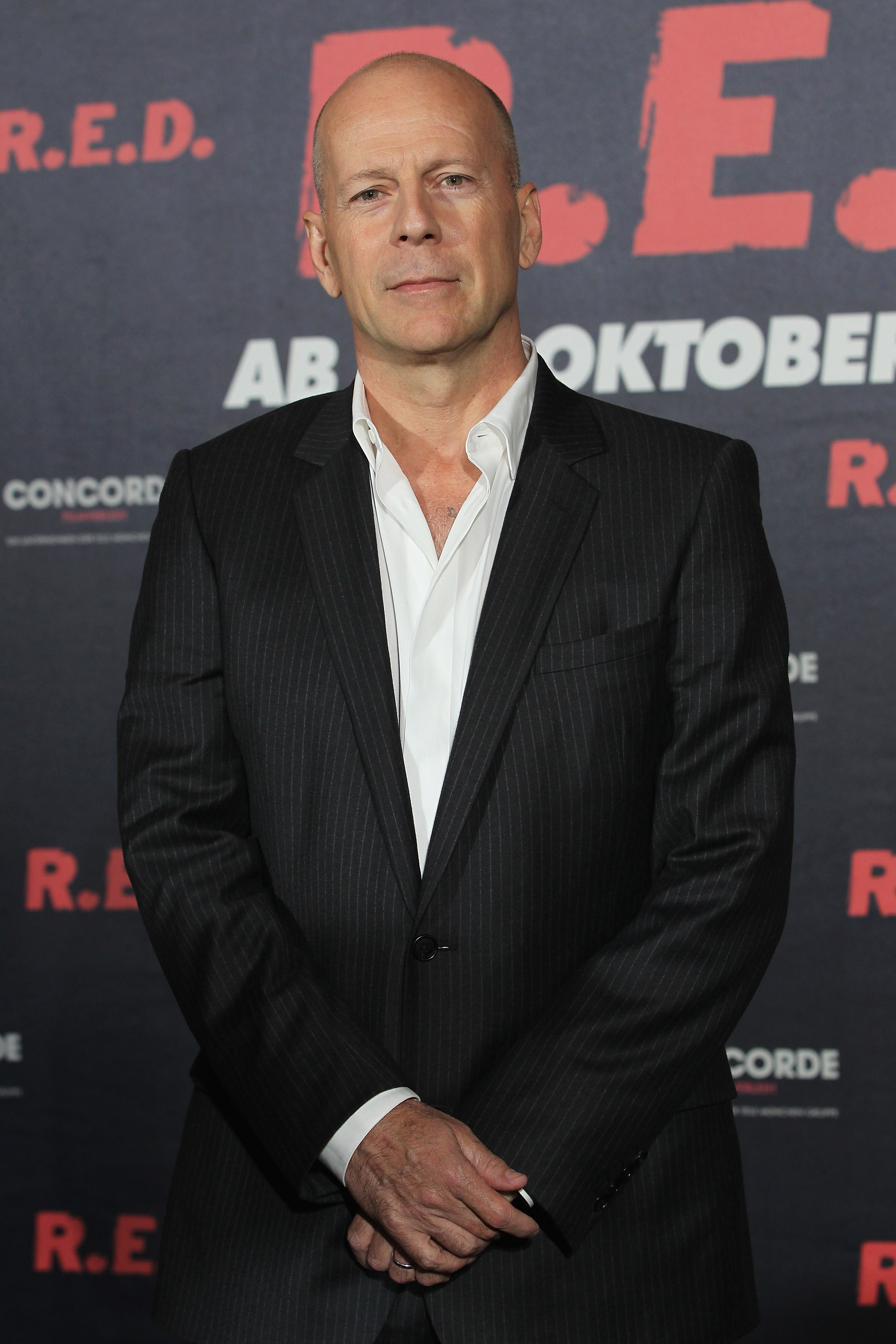 Bruce Willis attends a photocall to present the movie "RED" at the Regent Hotel on October 18, 2010, in Berlin, Germany. | Source: Getty Images