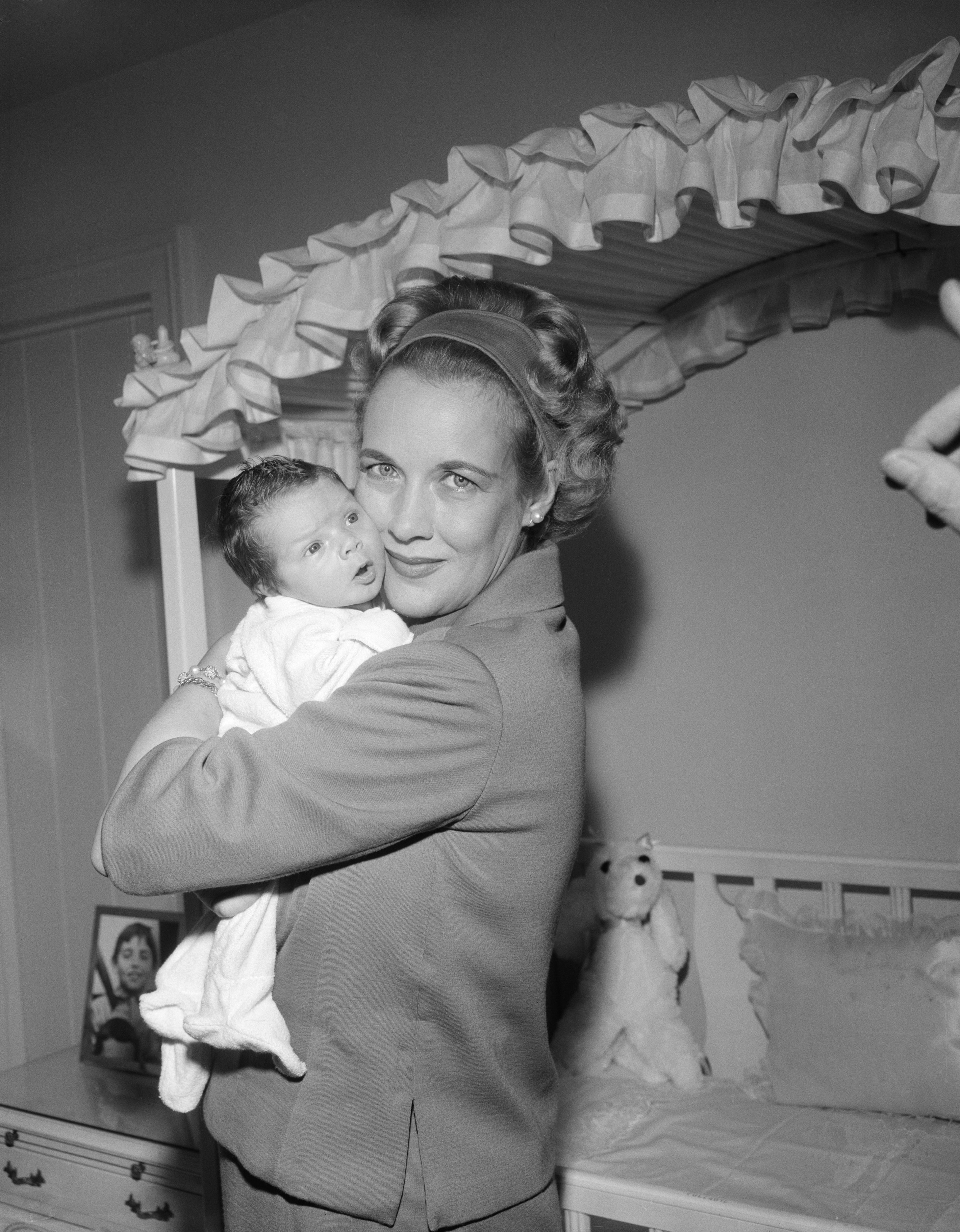 Kay Gable holds her two week old baby, John Clark Gable. | Source: Getty Images