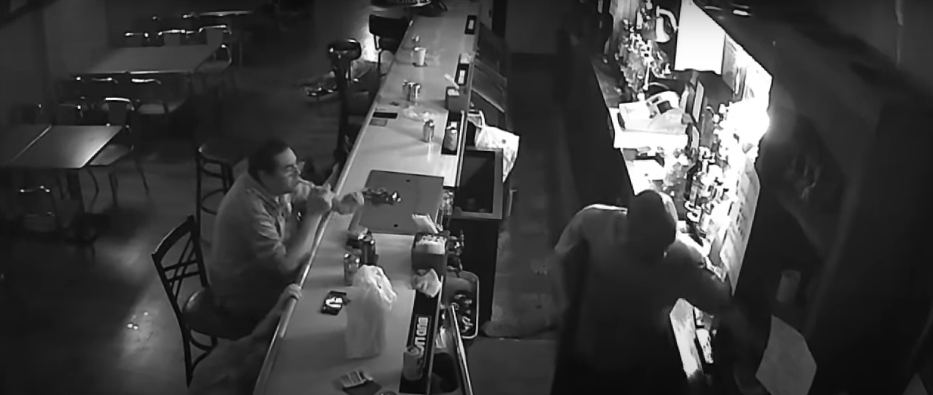 Tony Tovar calmy lighting up a cigarette while a gunman robs Behrmann's Tavern in St. Louis on a follow-up post uploaded on April 4, 2021 | Source: YouTube/Inside Edition