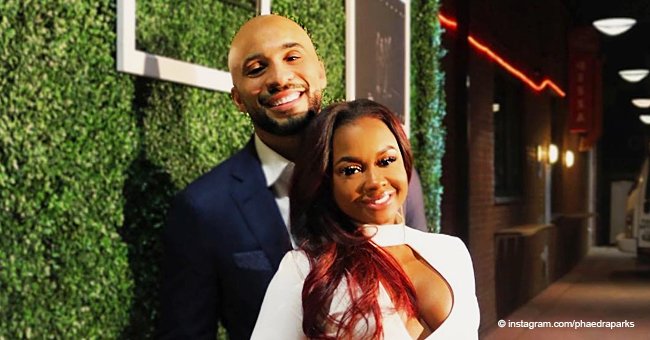 Phaedra Parks stuns in figure-hugging white dress while posing next to new boyfriend Tone Kapone