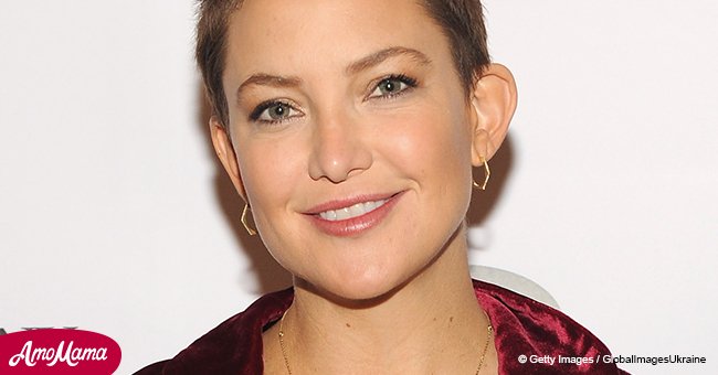 Mother-to-be Kate Hudson shows off her growing baby bump in red bikini