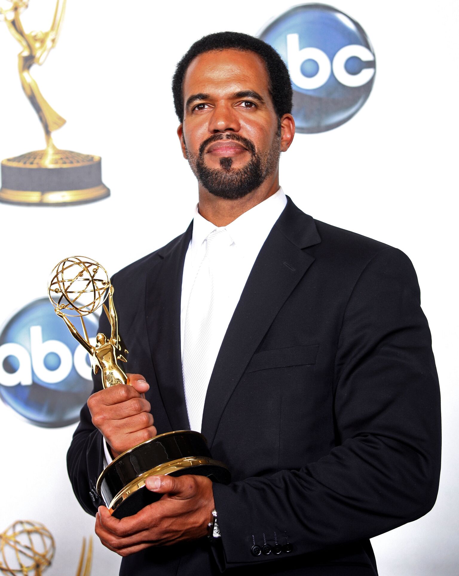 Kristoff St. John poses with the Outstanding Supporting Actor In A Drama Series award for "The Young and the Restless" | Getty Images