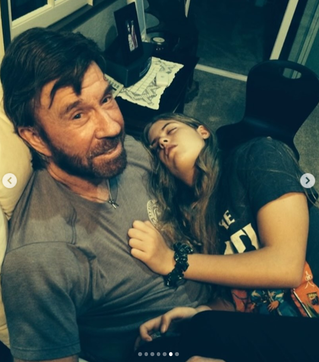 Chuck Norris relaxes as Danilee rests against him at home | Source: Instagram/d.ani.lee